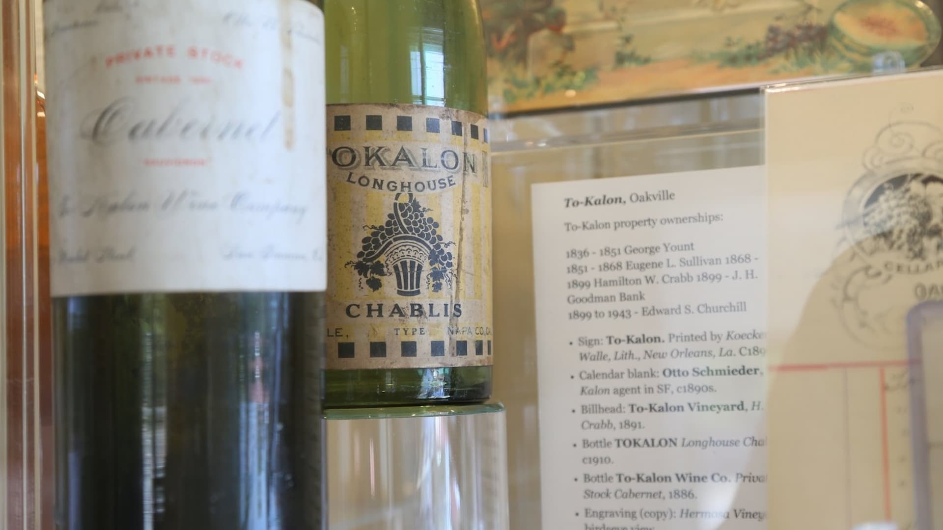 Vintage wine bottles with labels and historical text.