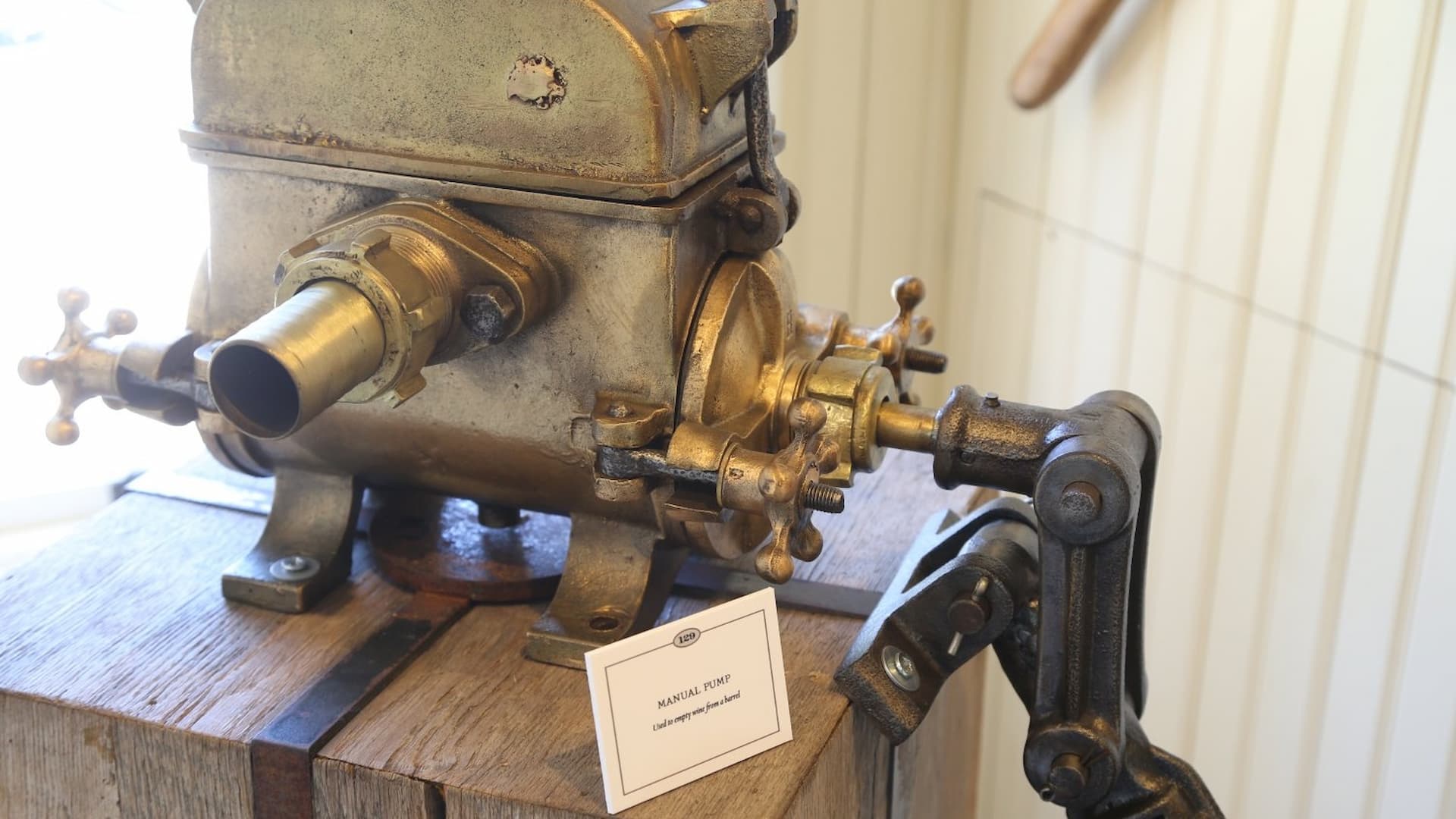Vintage manual pump on wooden base