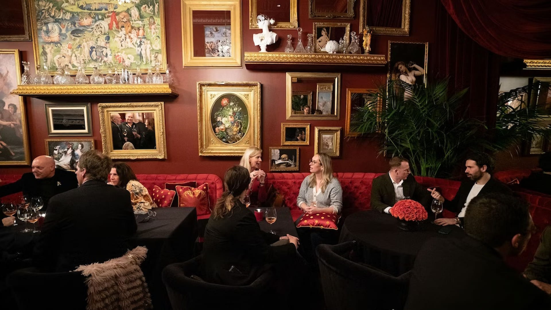 People dining in a richly decorated restaurant.