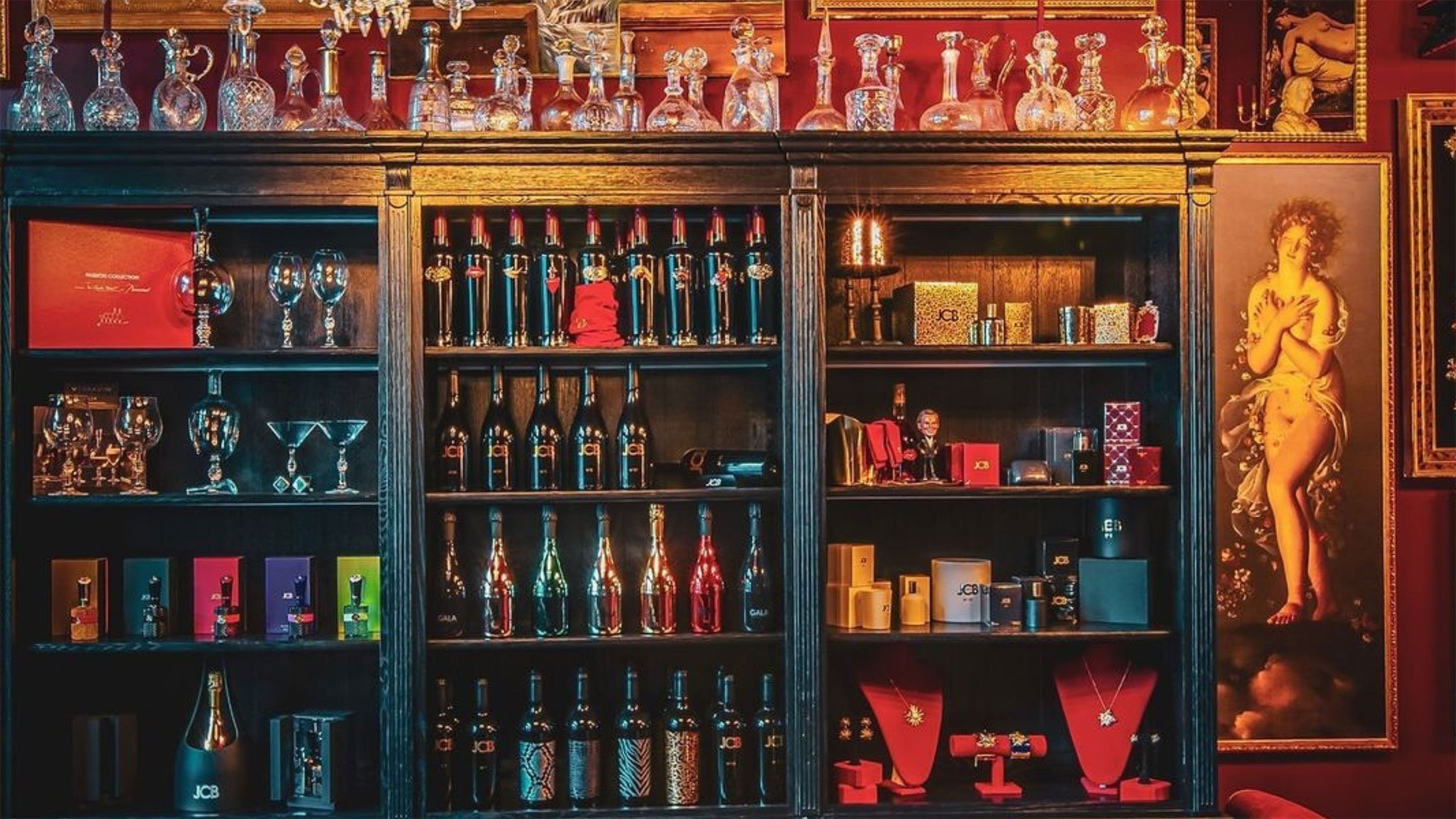 Luxurious wine bottles and decanters displayed on shelves.