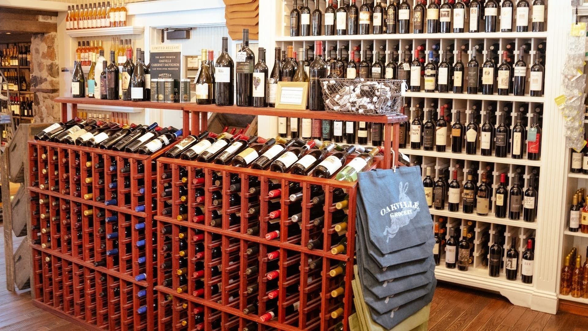 Wine bottles displayed in store shelves.