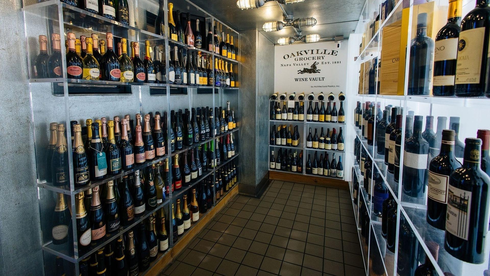 Wine bottles displayed on shelves in a store.