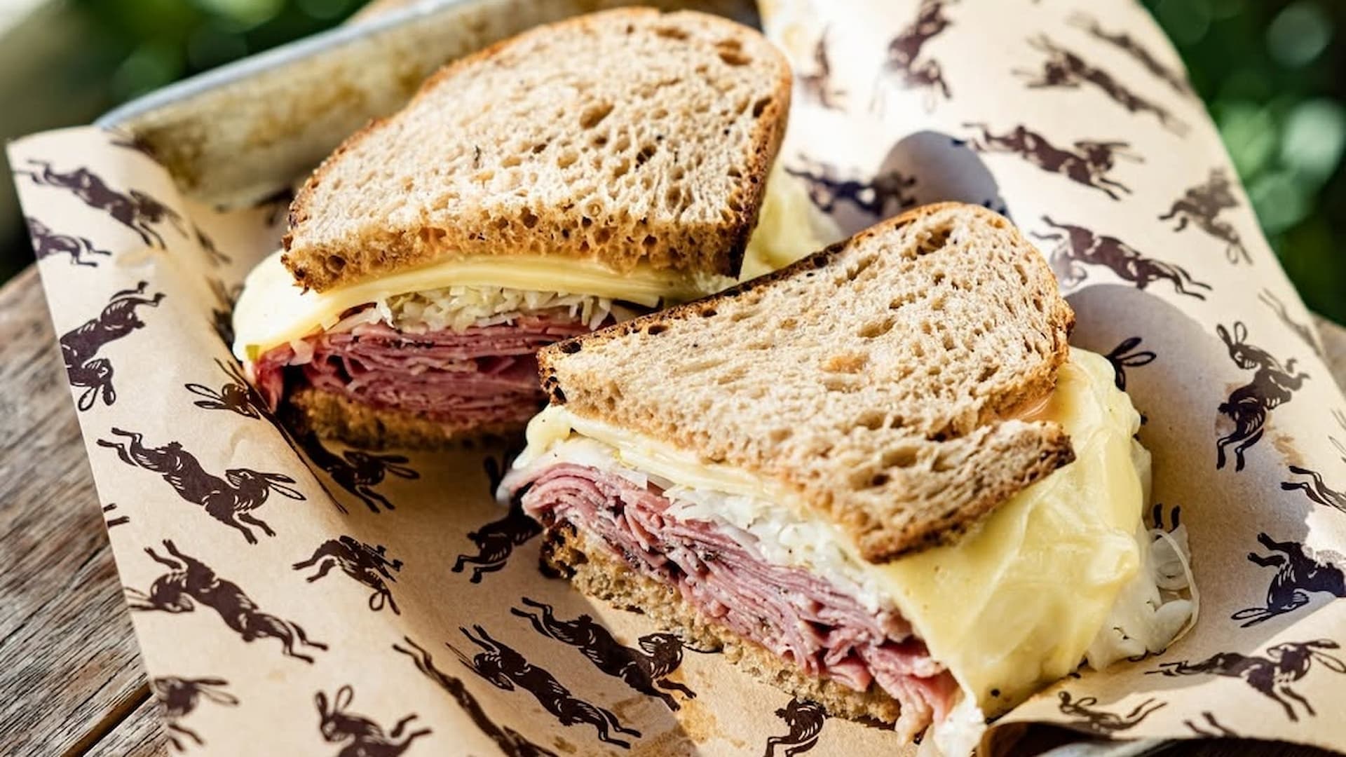 Pastrami sandwich with cheese on rye bread