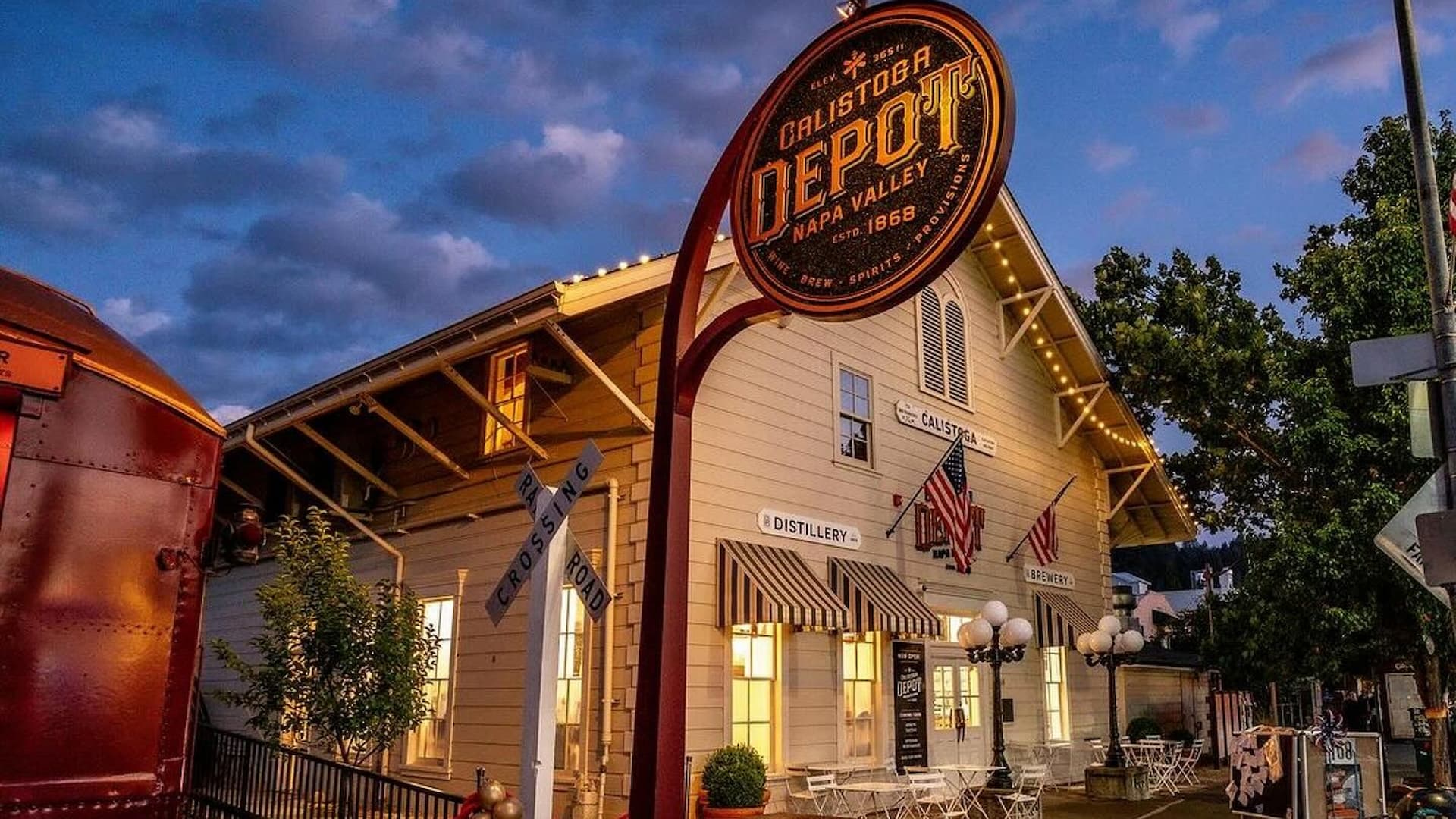 Historic train depot in Napa Valley at dusk.