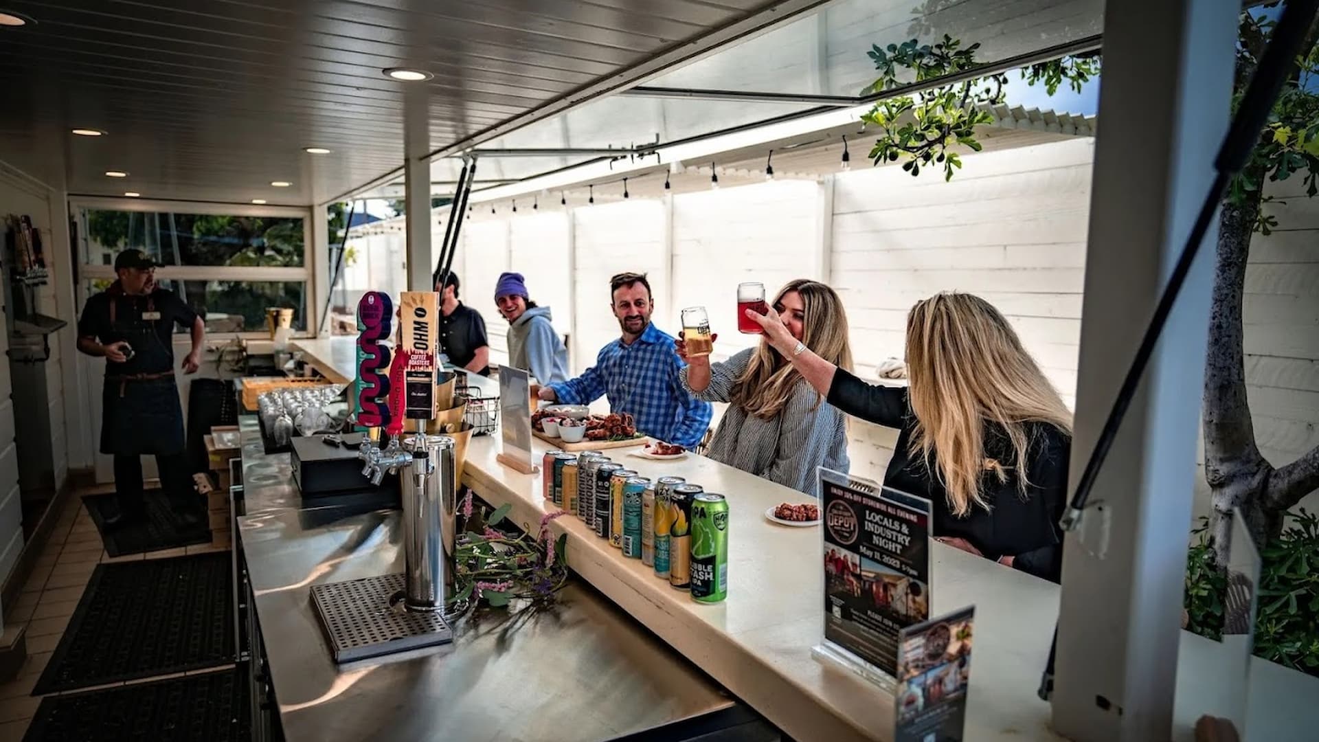 Group enjoying drinks at outdoor bar