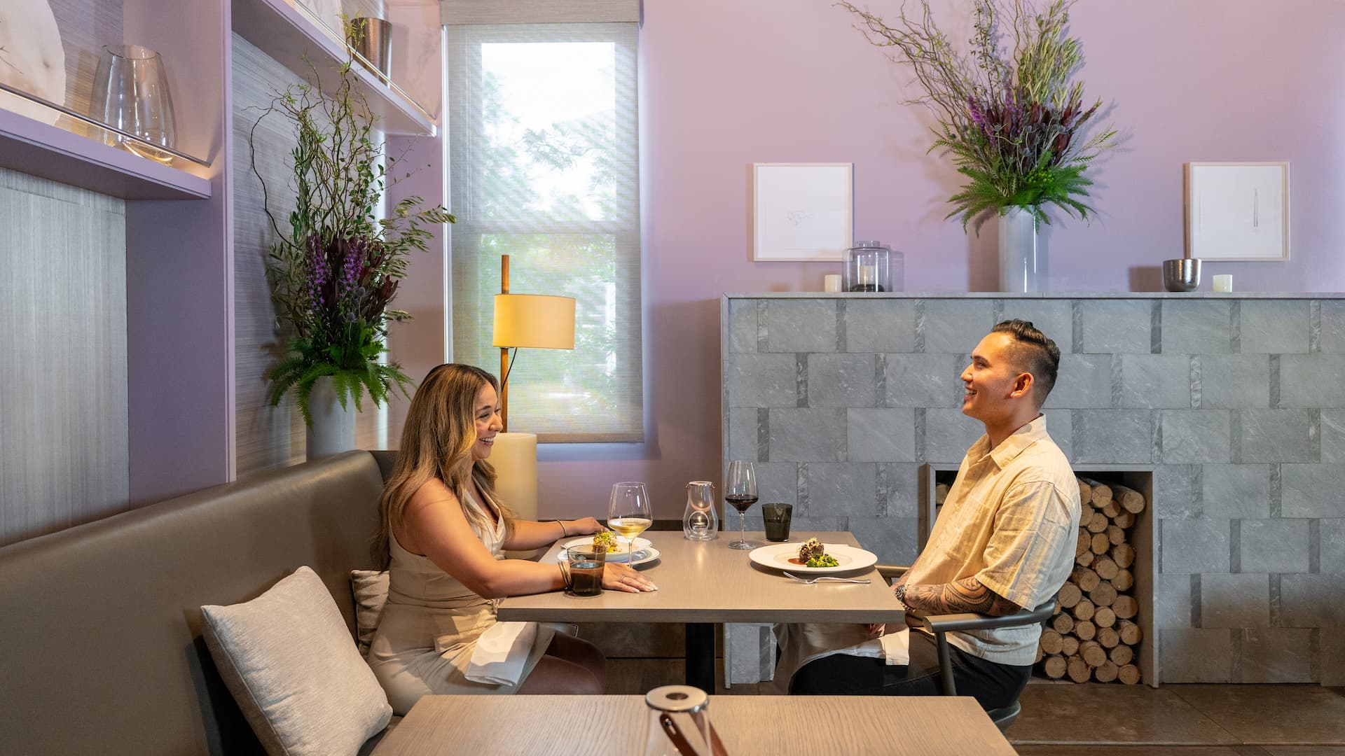 Couple dining at a cozy restaurant table.