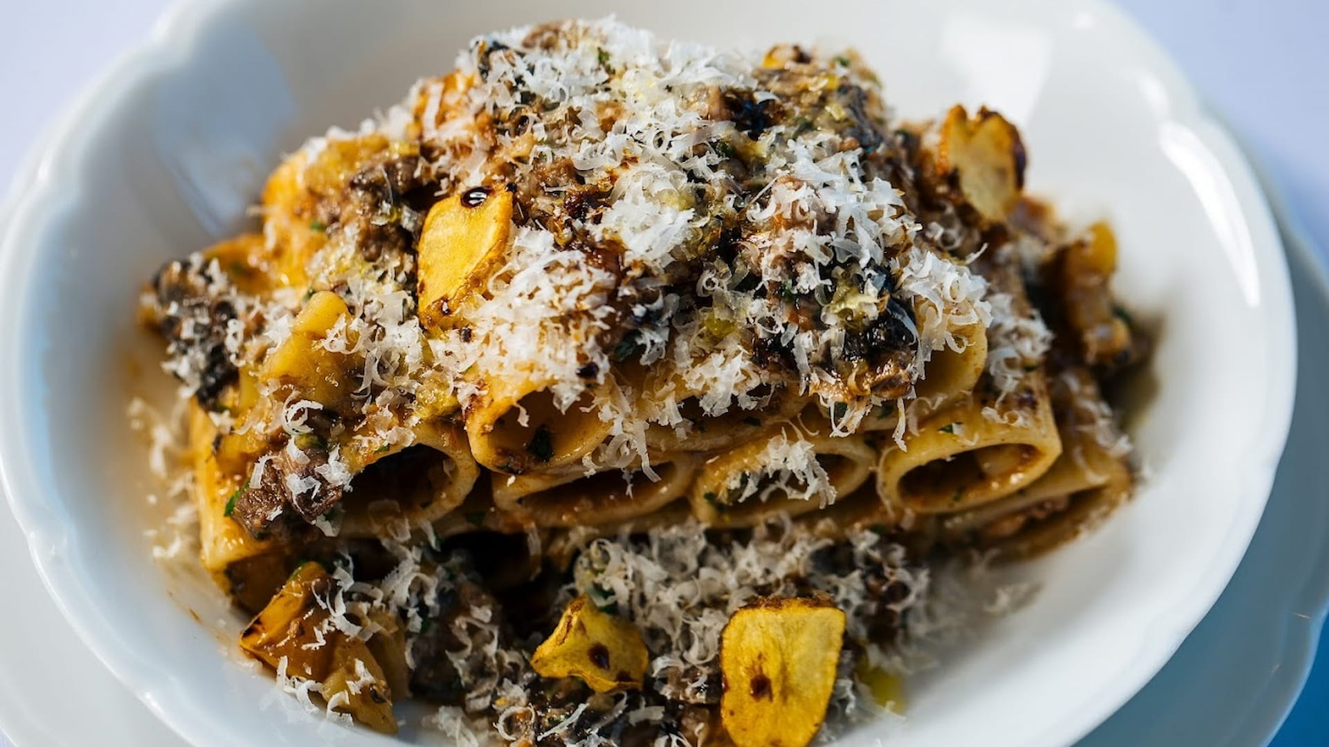 Pasta with truffle sauce and grated cheese.