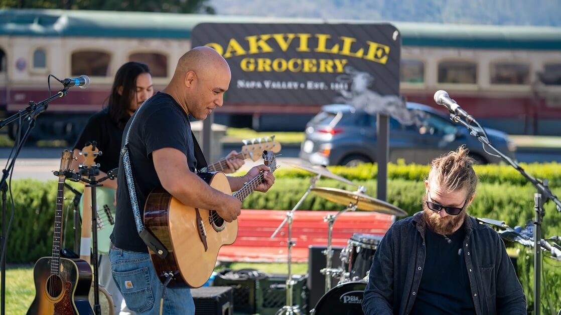 Musicians performing outside Oakville Grocery