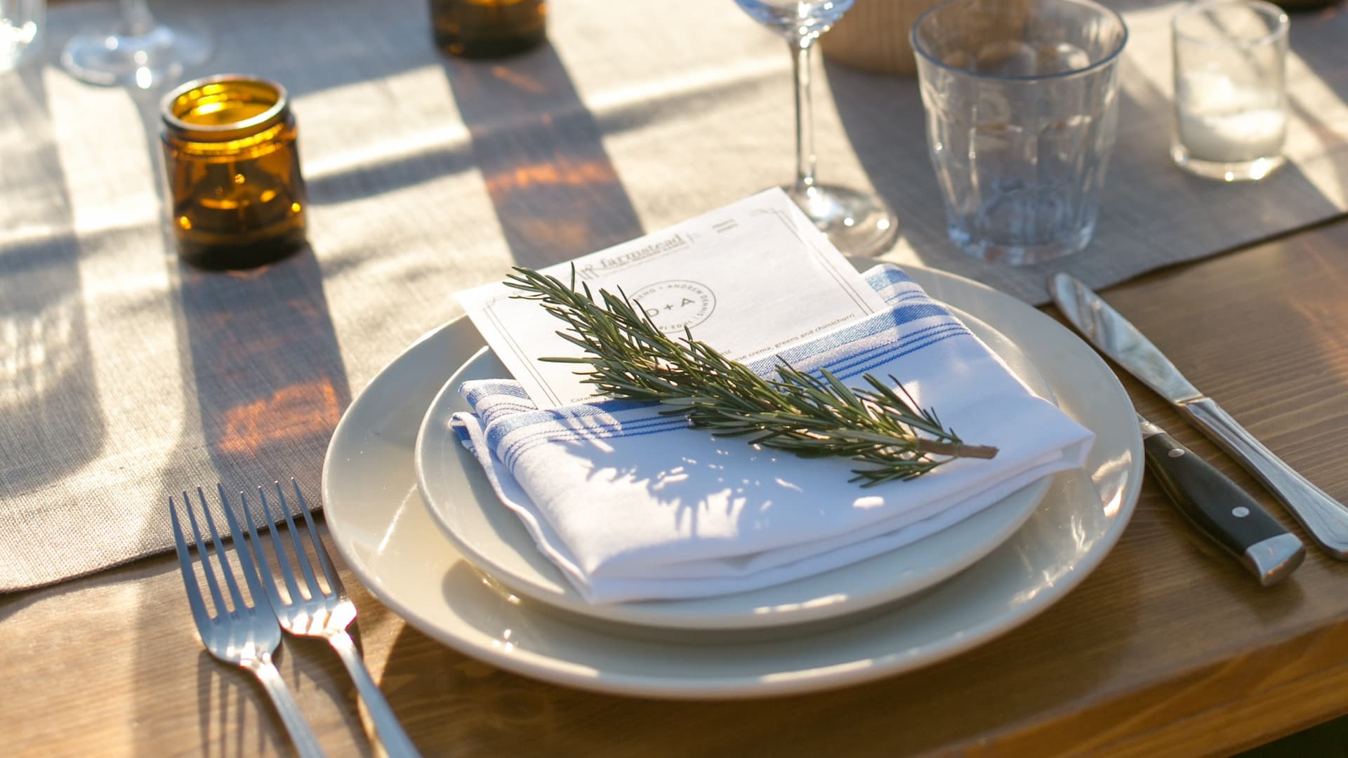 Elegant dining table with rosemary garnish