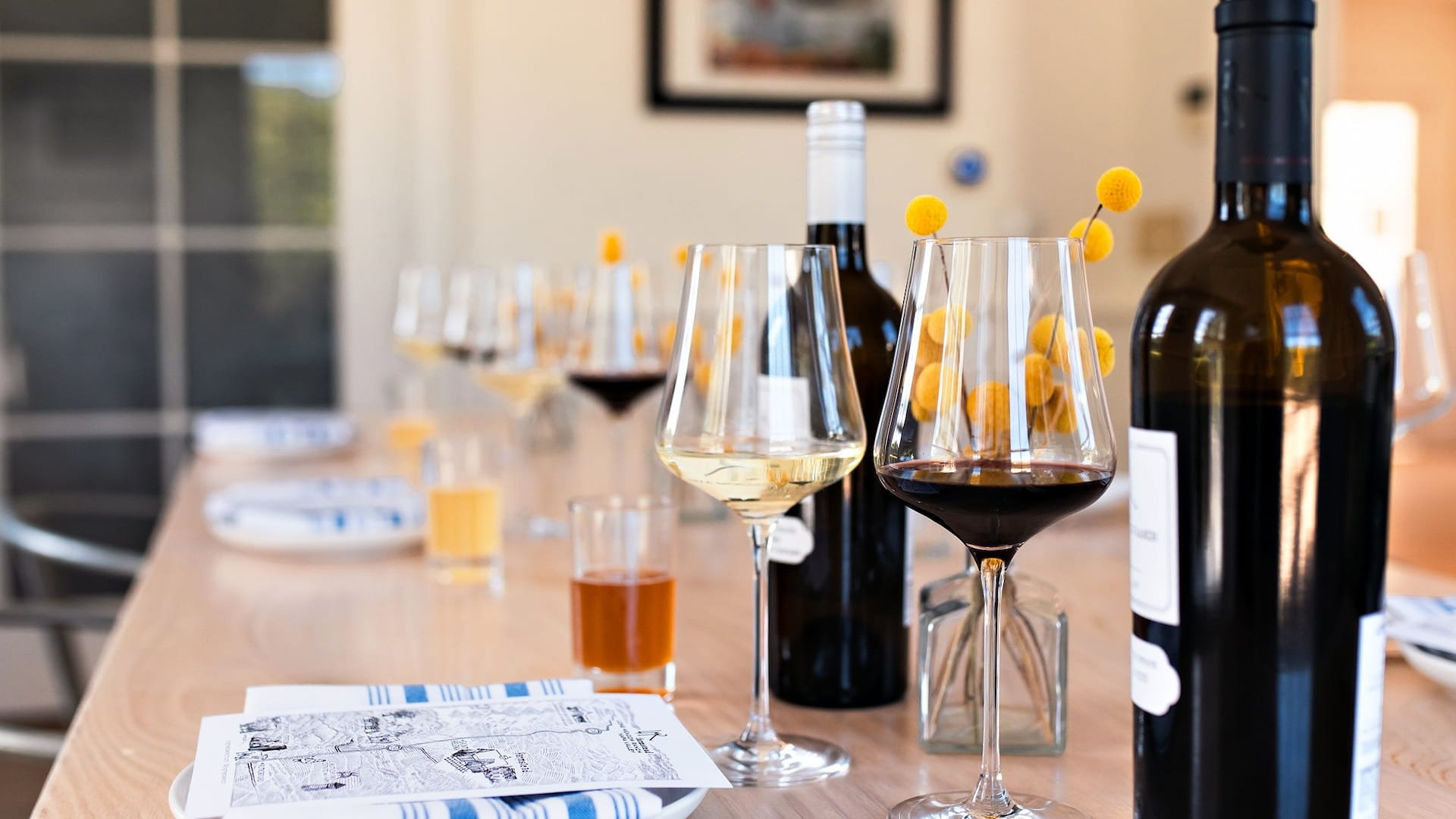 Wine glasses on wooden dining table setup
