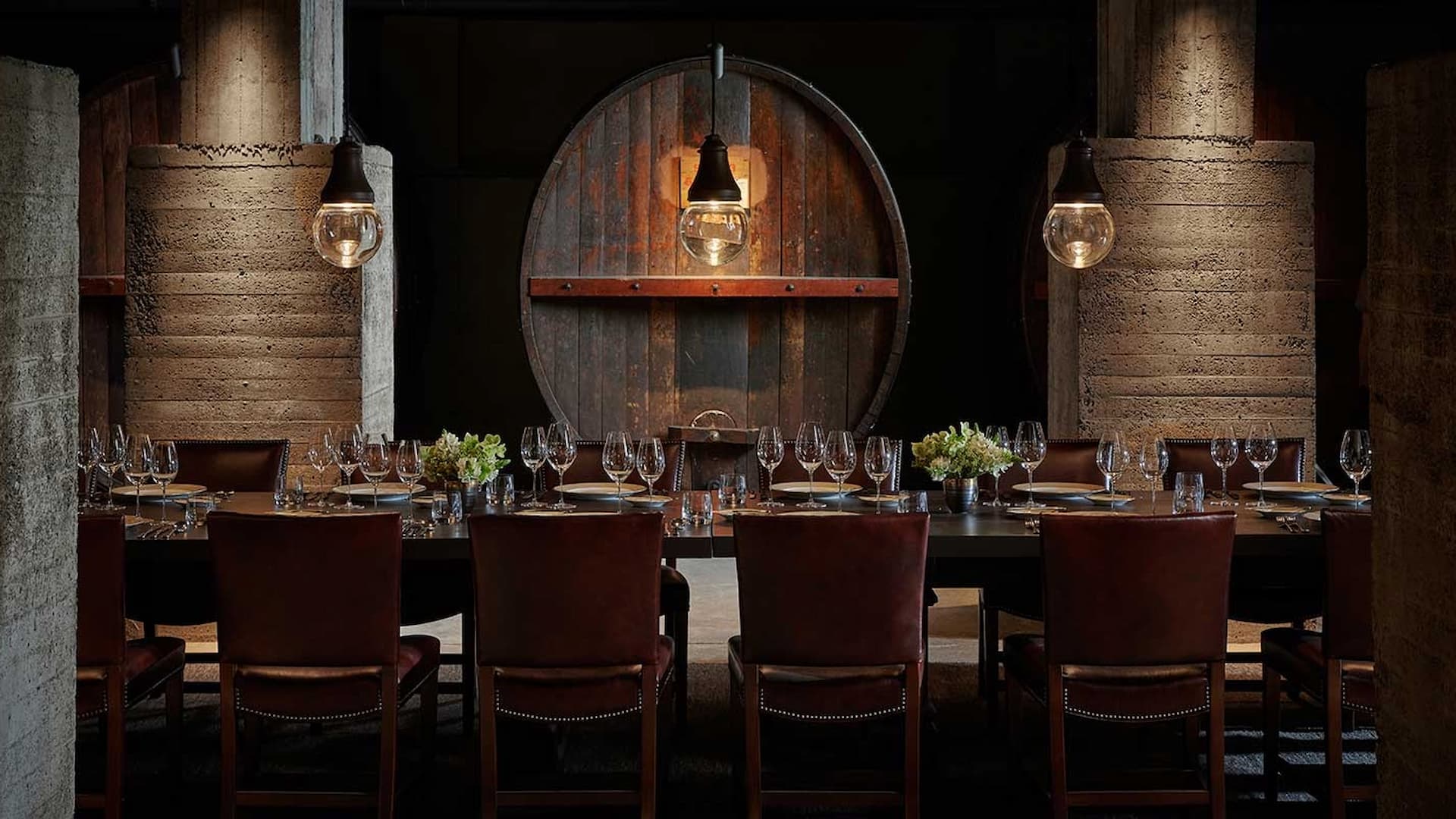 Elegant dining room with wooden barrel decor.