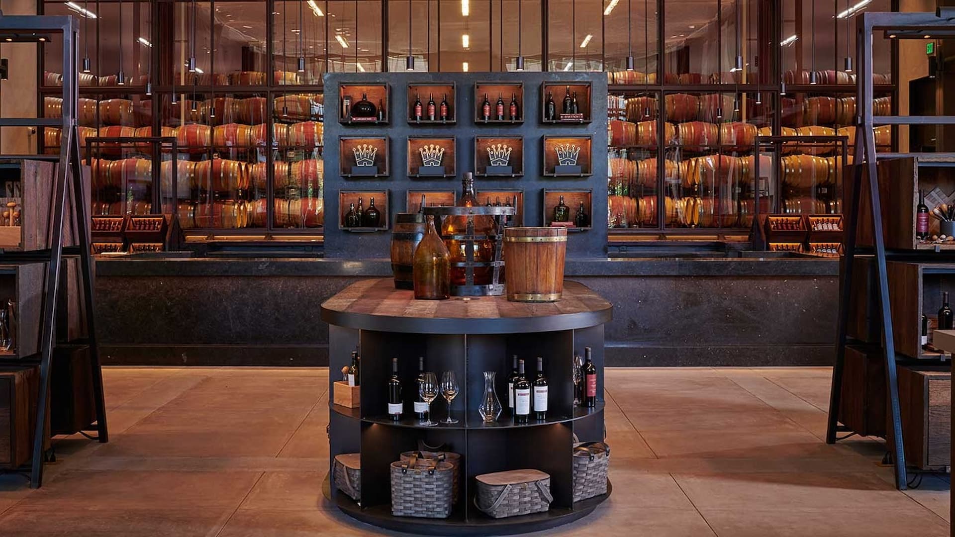 Wine barrels and bottles in a stylish winery.