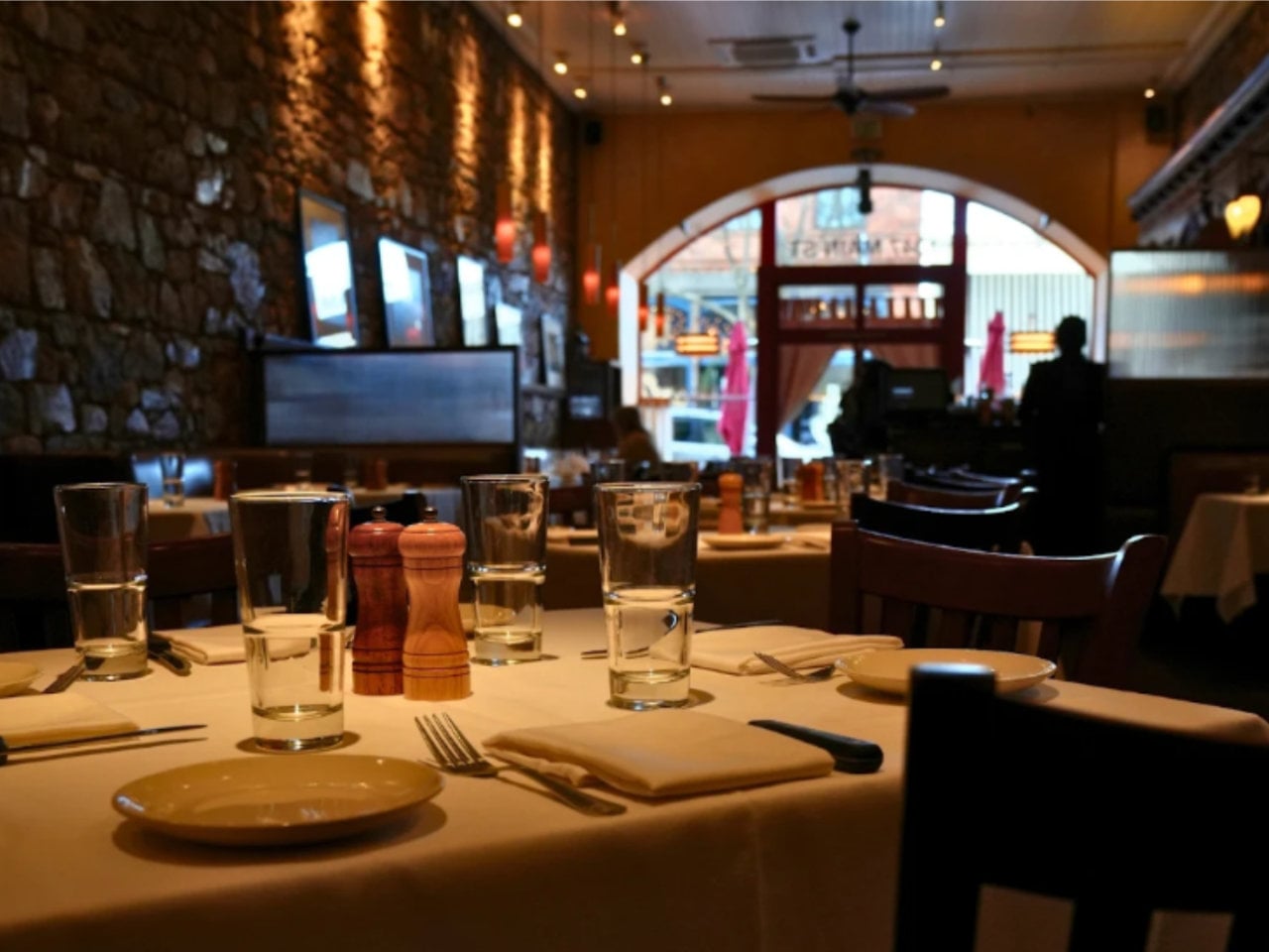 Cozy restaurant interior with set dining tables
