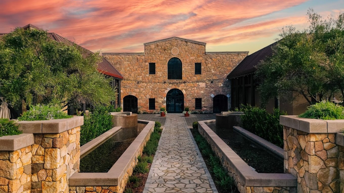 Stone building with sunset sky backdrop