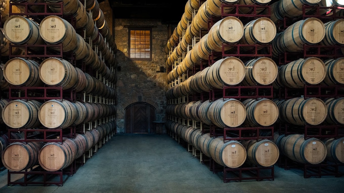 Stacked wine barrels in a cellar