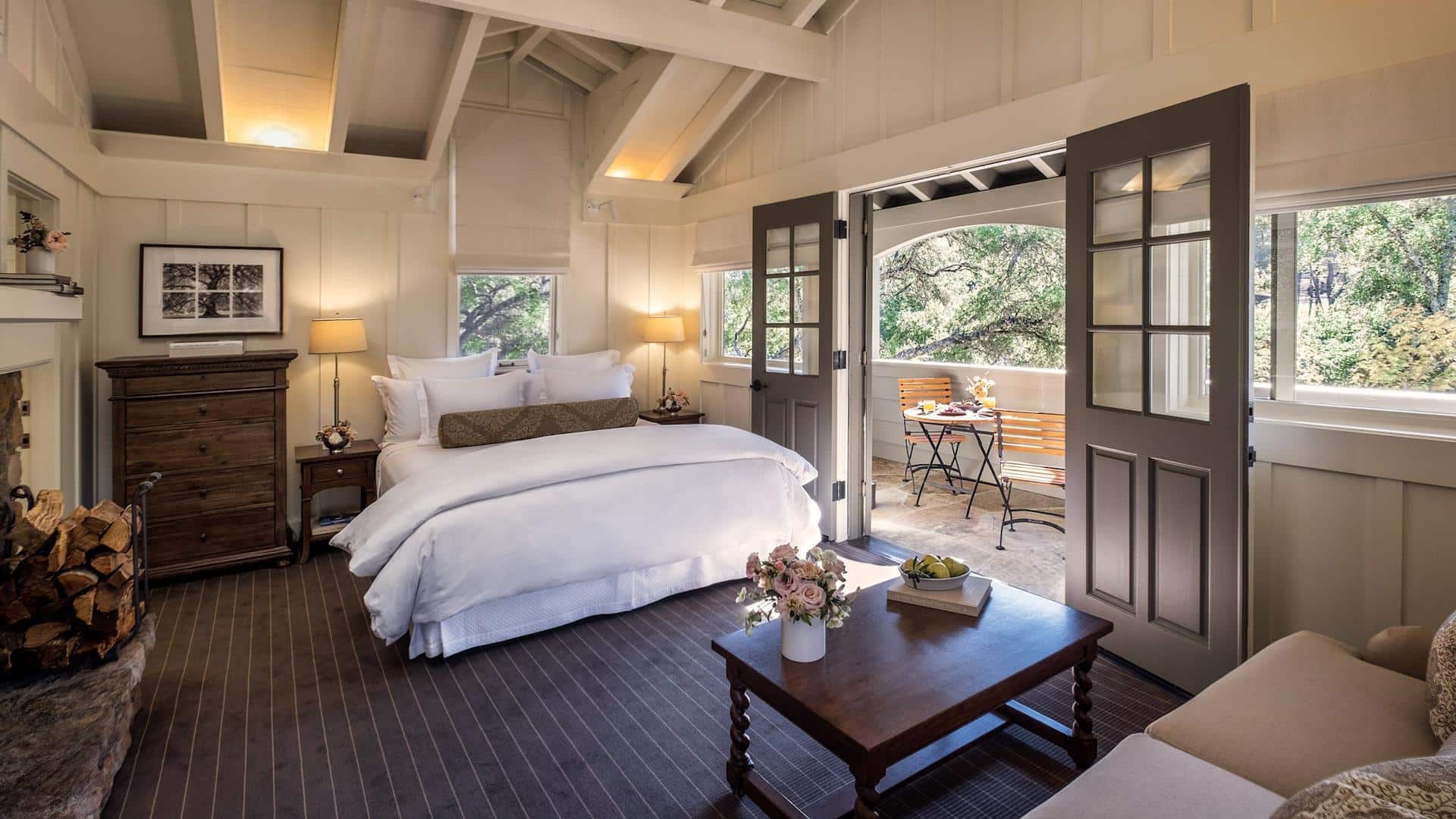Cozy bedroom with open doors to patio view.