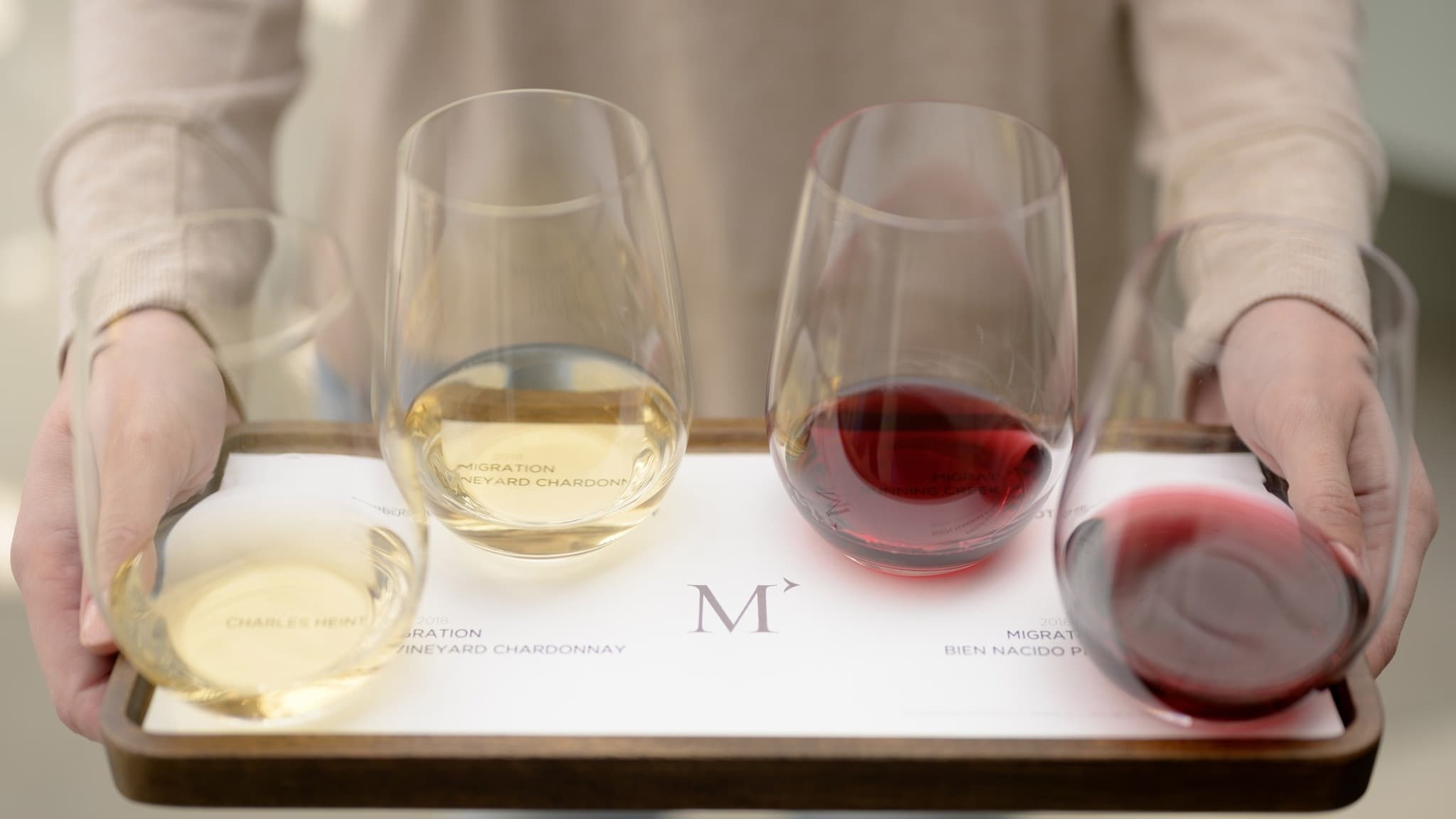 Tray with glasses of white and red wine.