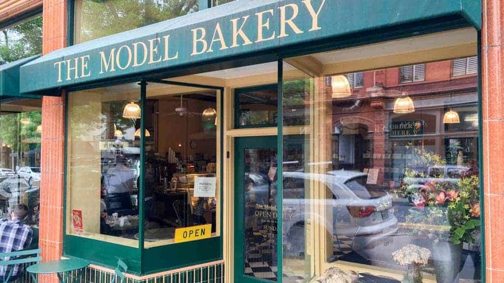 The Model Bakery storefront with green awning.