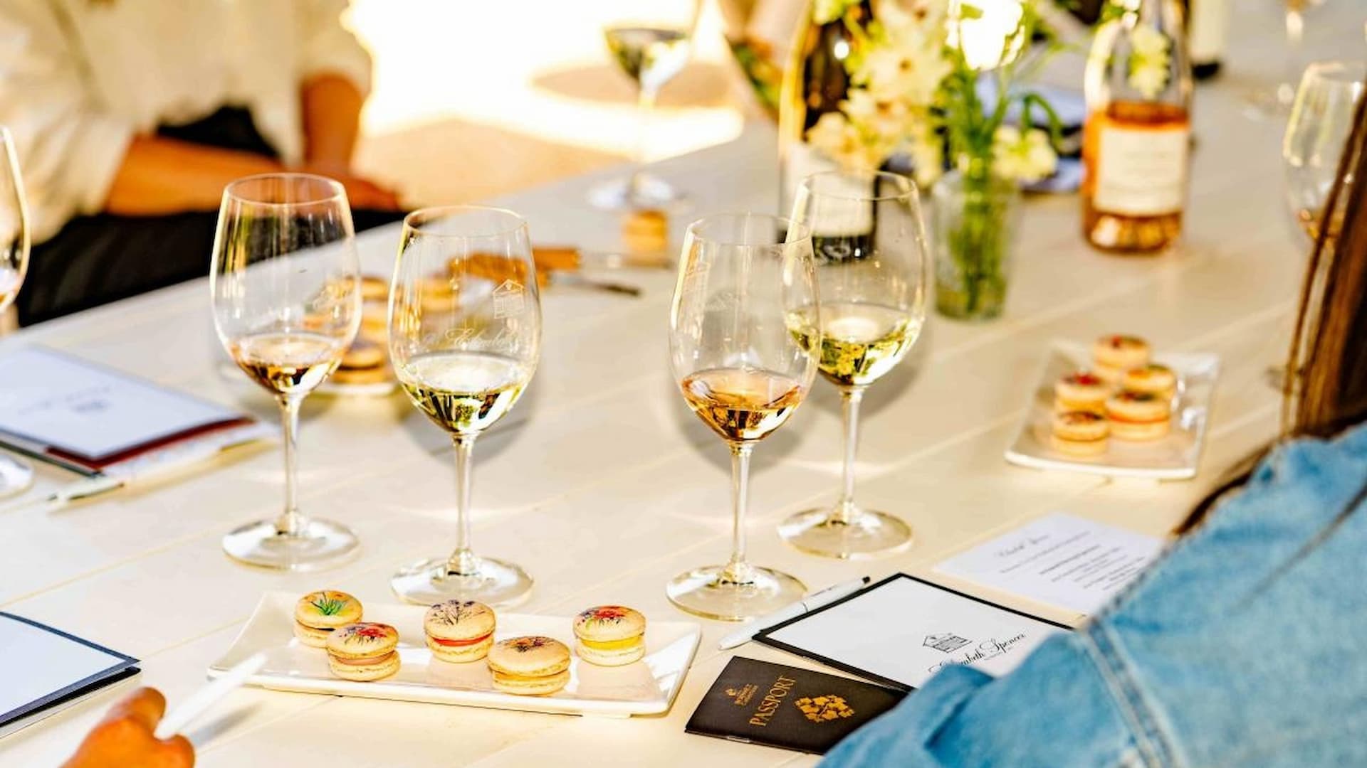 Wine tasting setup with glasses and macarons
