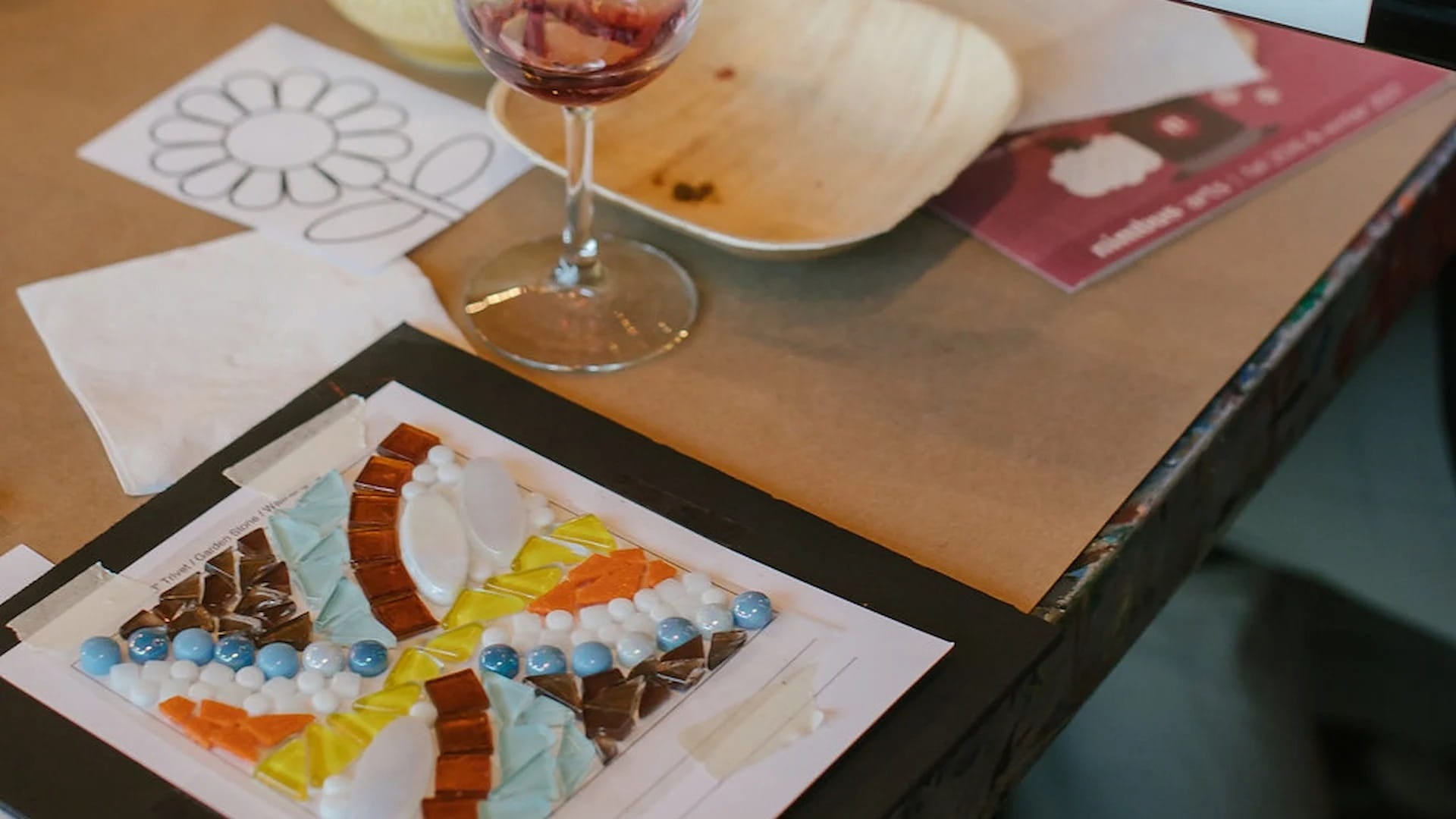 Colorful glass mosaic art project on table