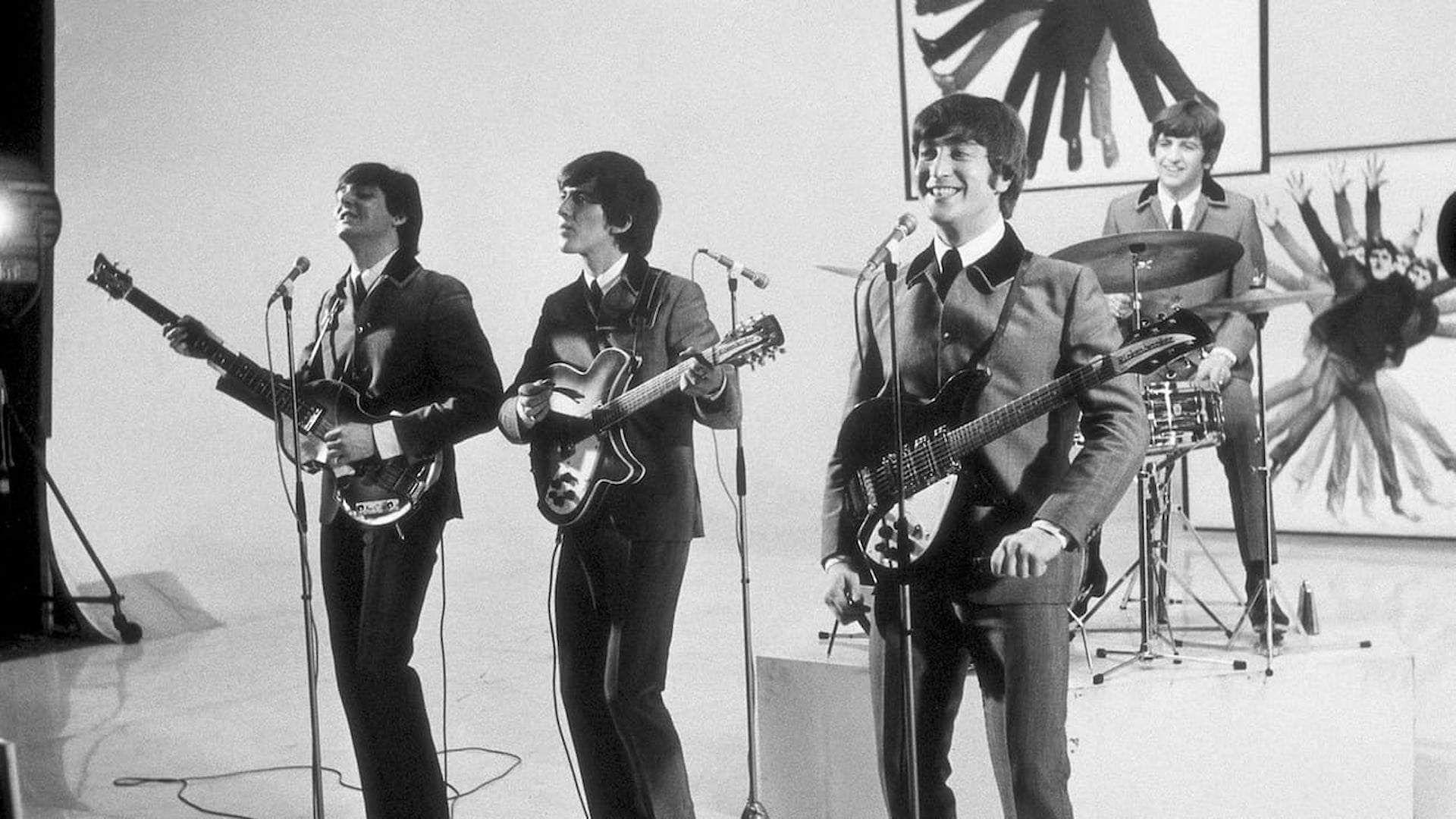 1960s band performing with guitars and drums
