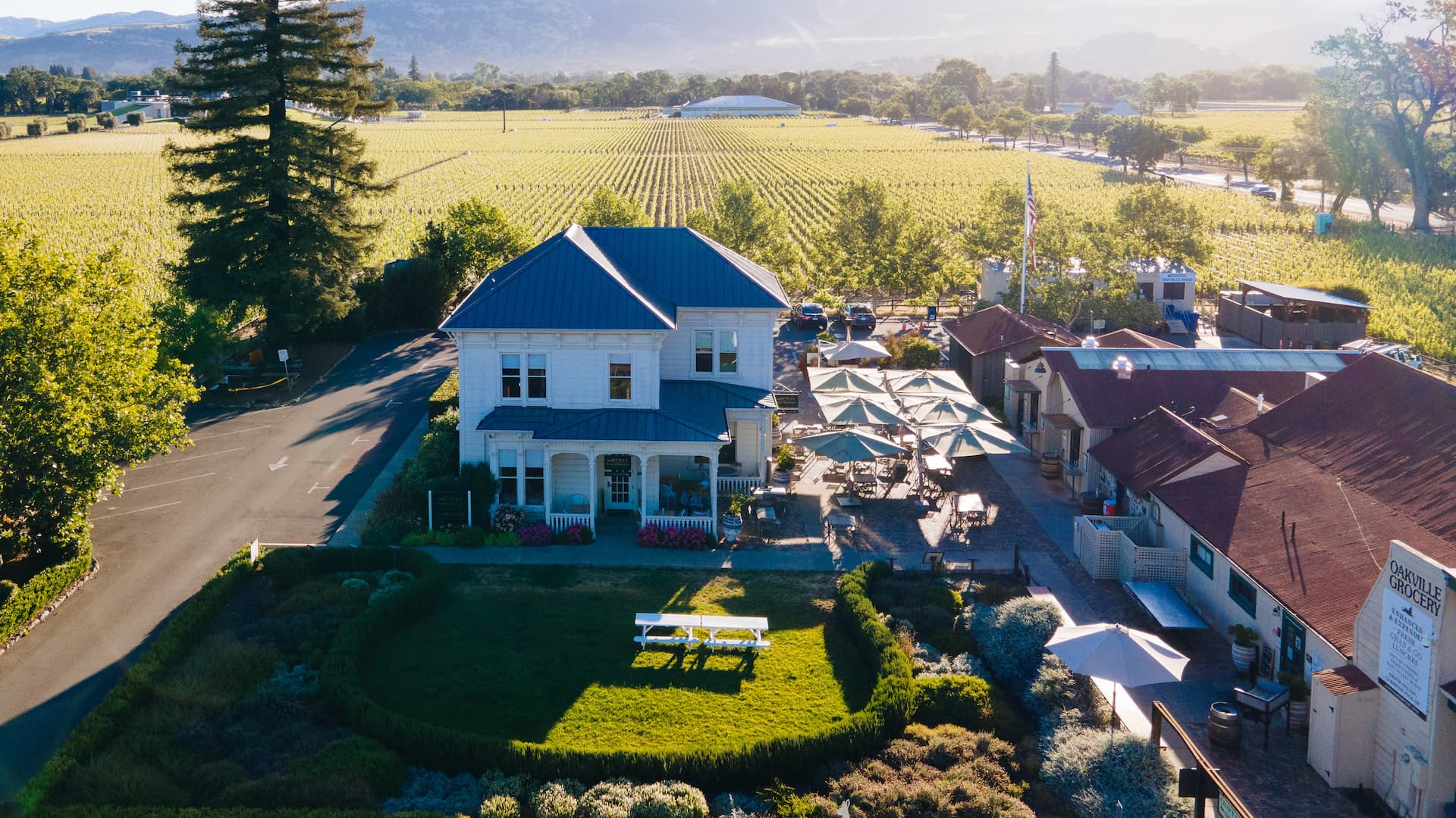 Aerial view of countryside house with garden.