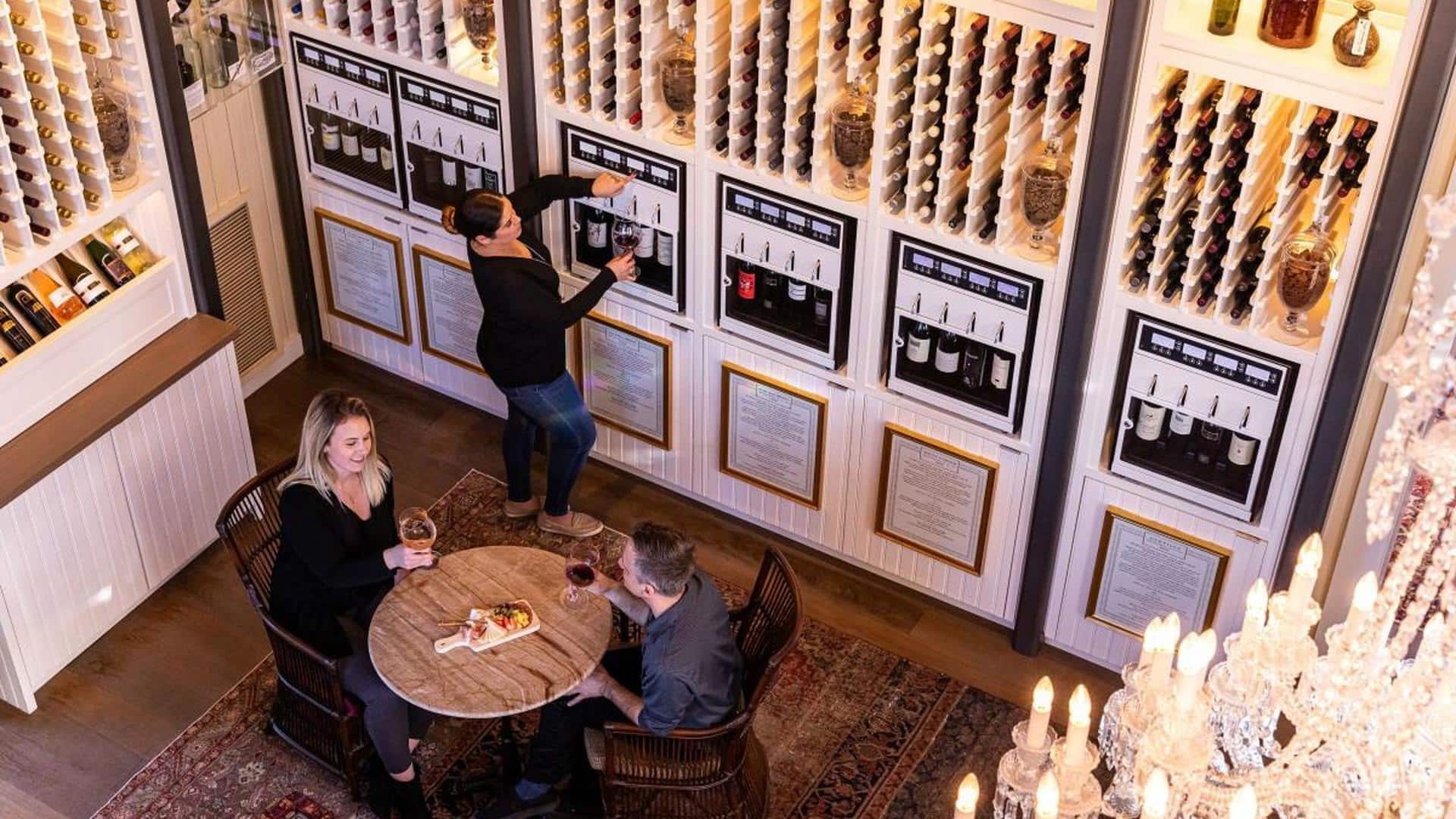 People enjoying wine at automated dispensing station.