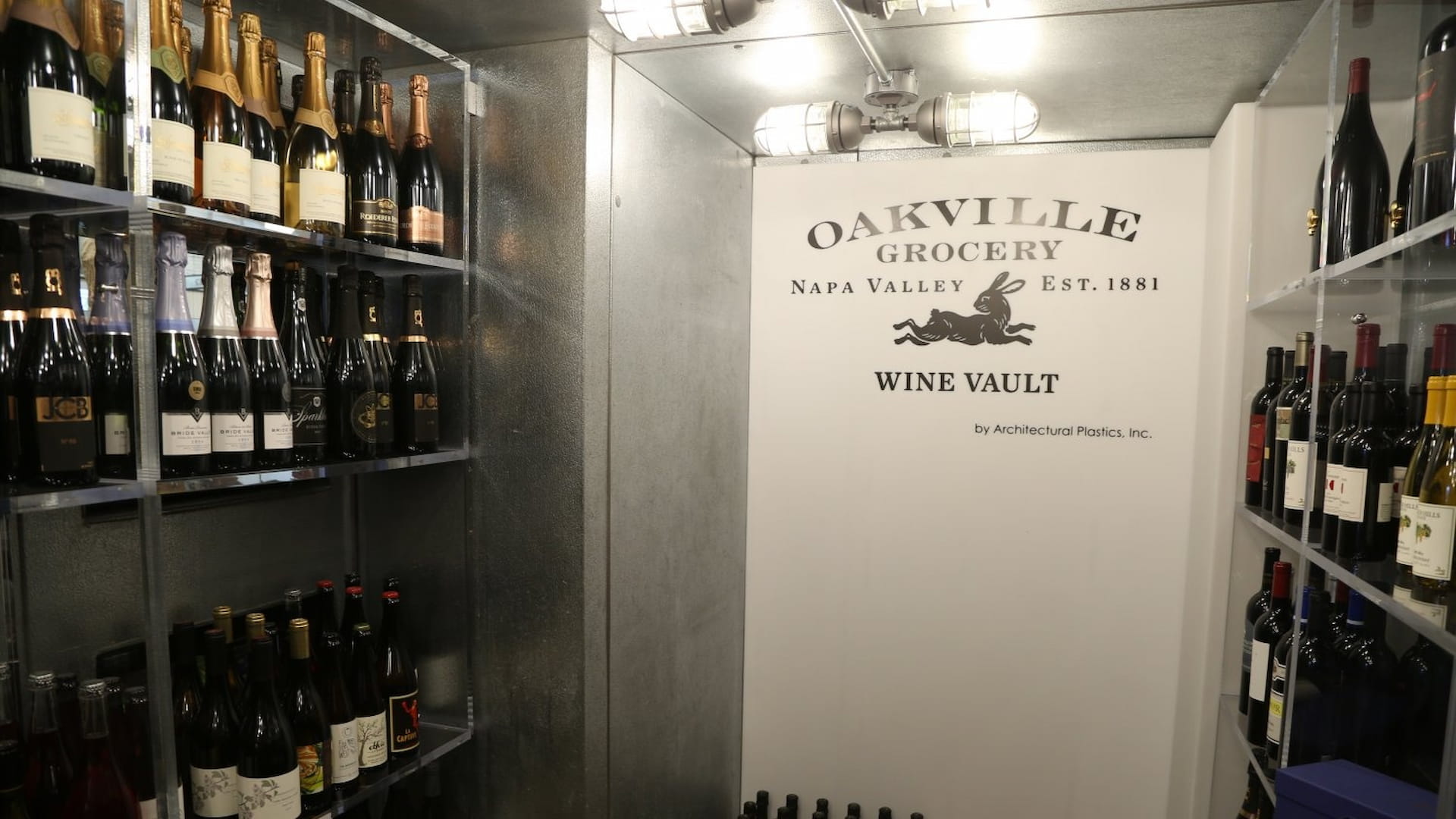 Oakville Grocery wine vault with shelves of bottles.