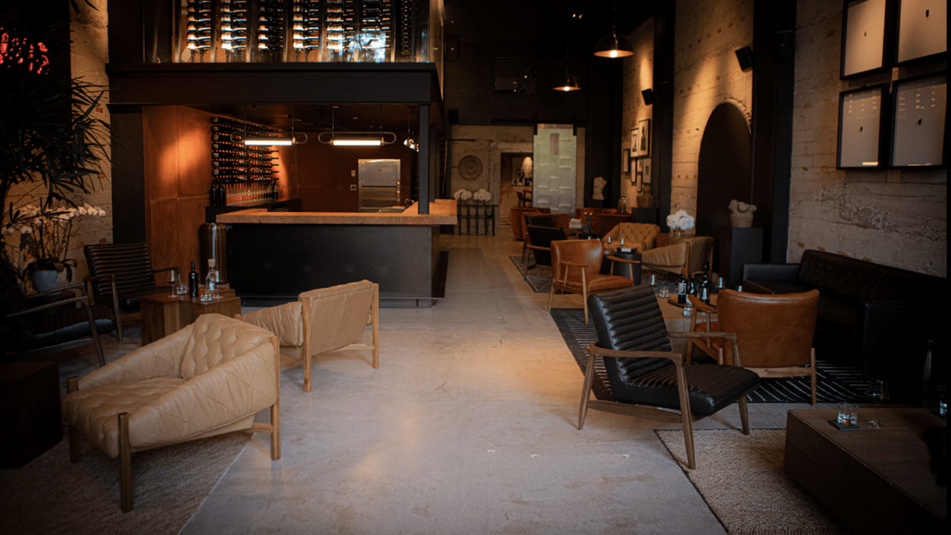Cozy lounge area with leather seating and bar