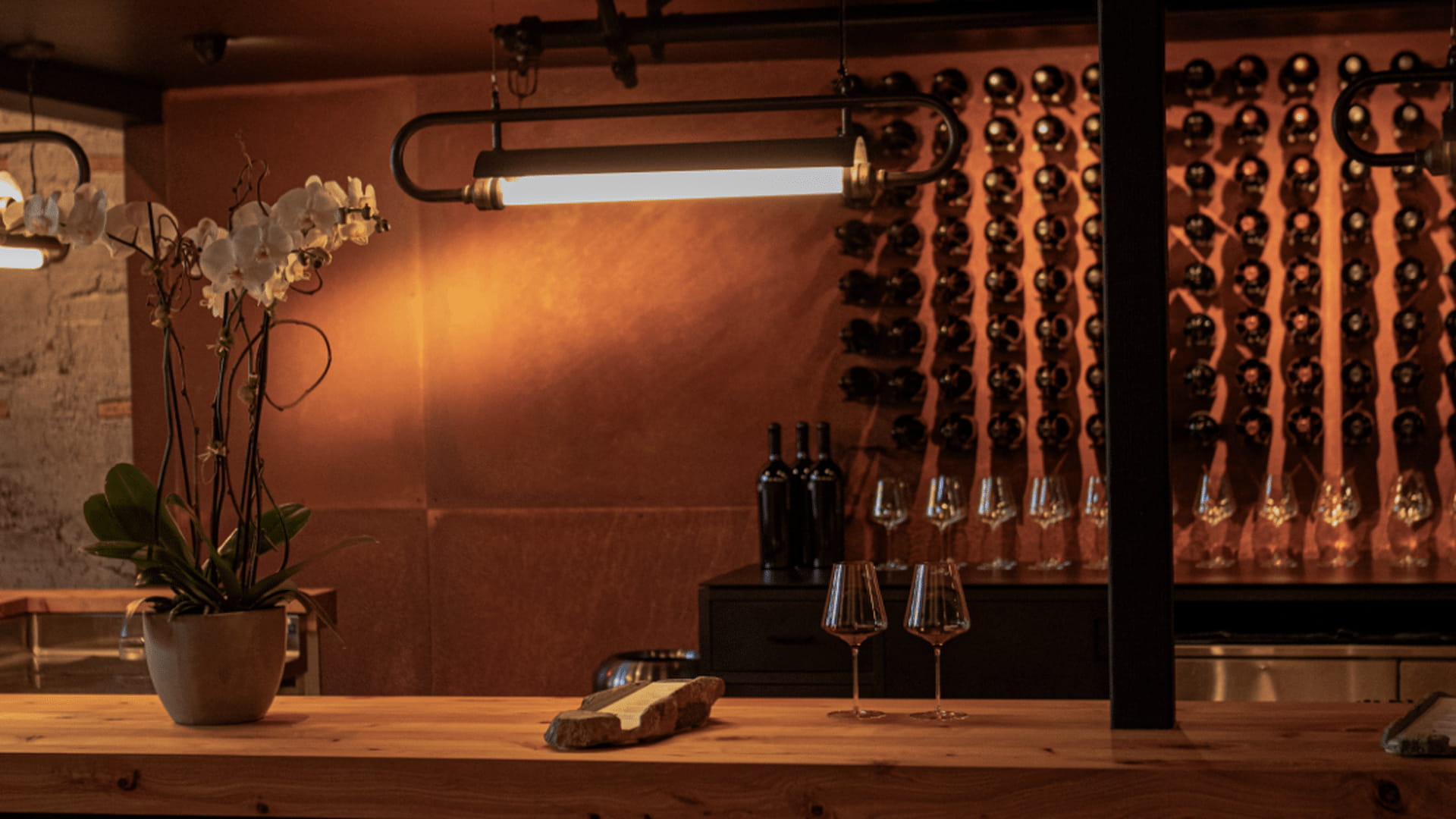 Wine bar with bottles and glasses displayed elegantly.