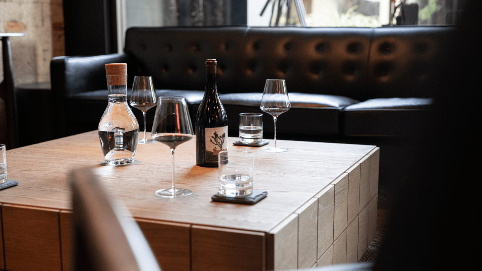 Table with wine glasses and bottle