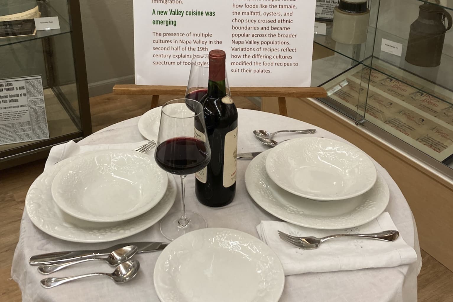 Museum display table set with wine and dishes