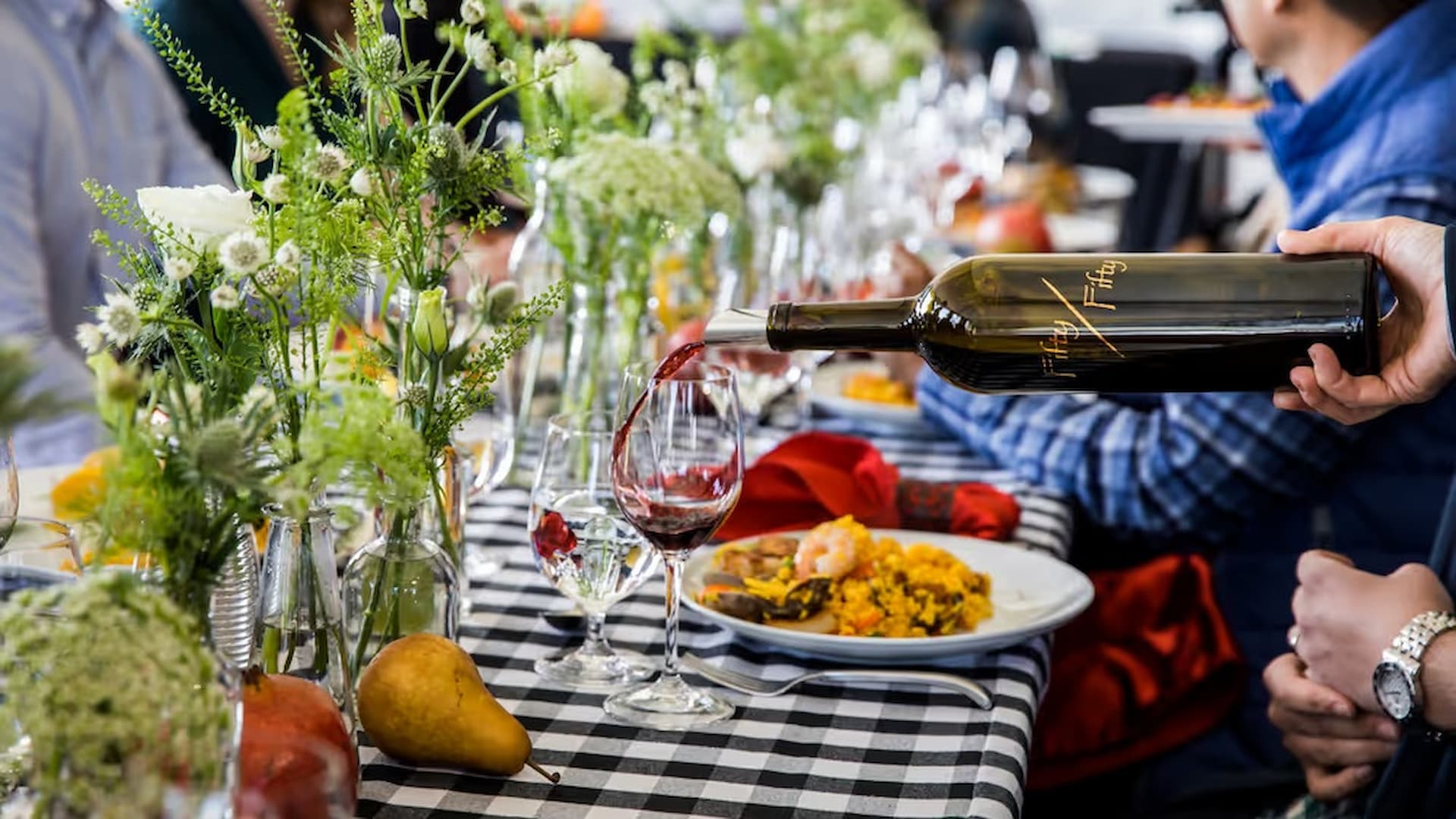 Wine poured at elegant table setting with meal