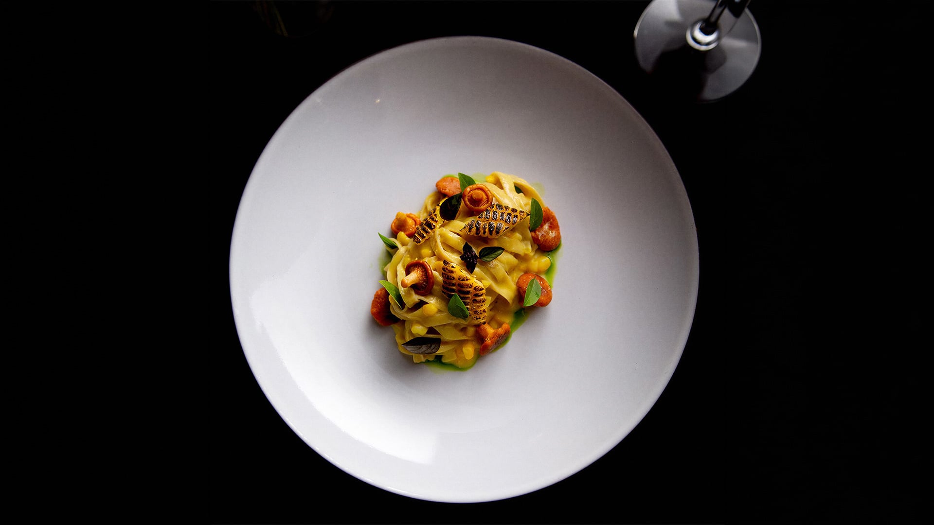 Gourmet pasta with seared corn and mushrooms