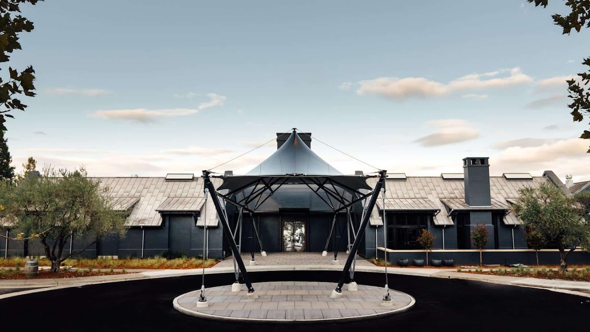 Modern building with unique metal structure entrance.