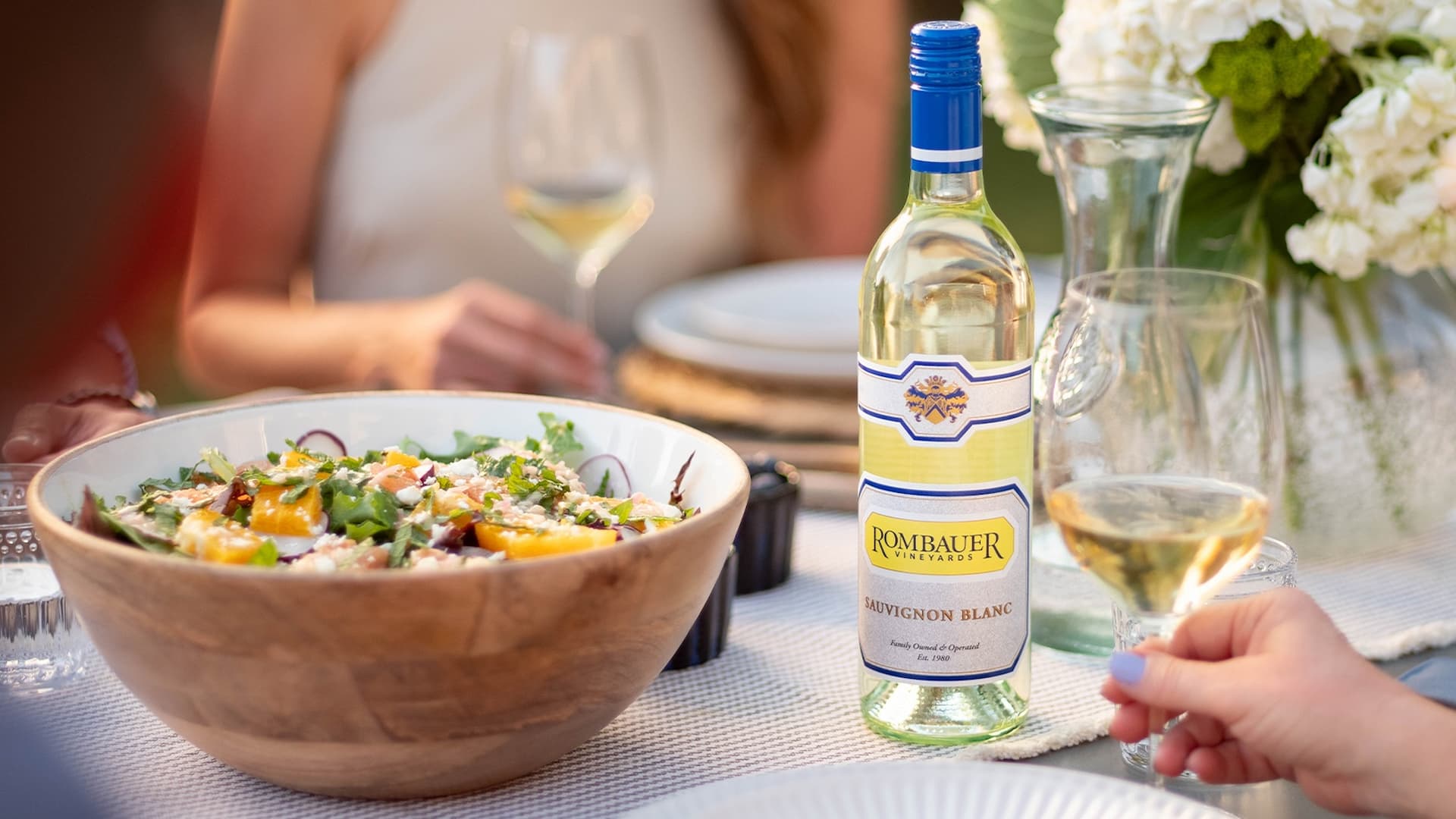 Sauvignon Blanc wine with fresh salad outdoors