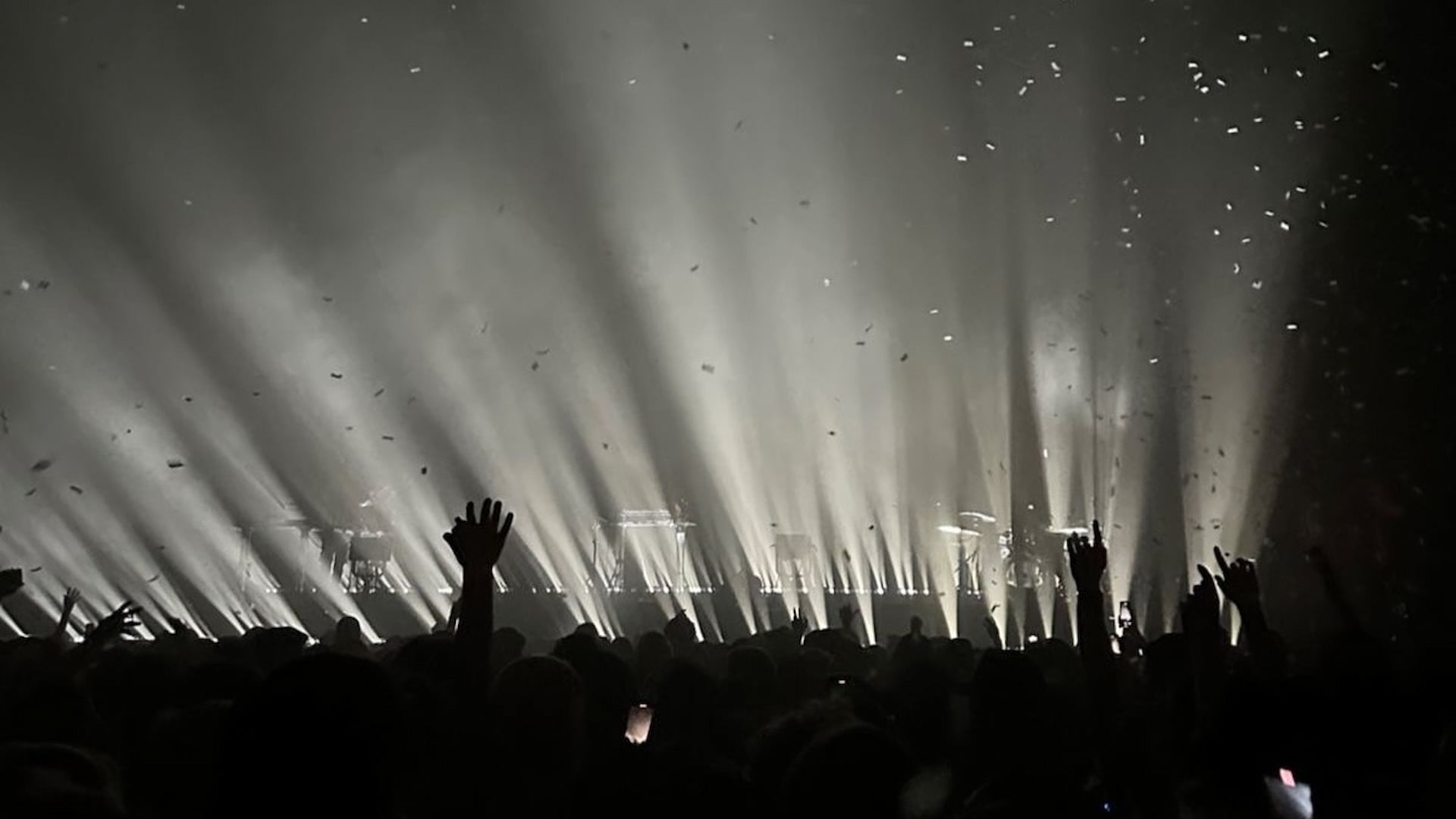 Concert crowd with dramatic stage lighting