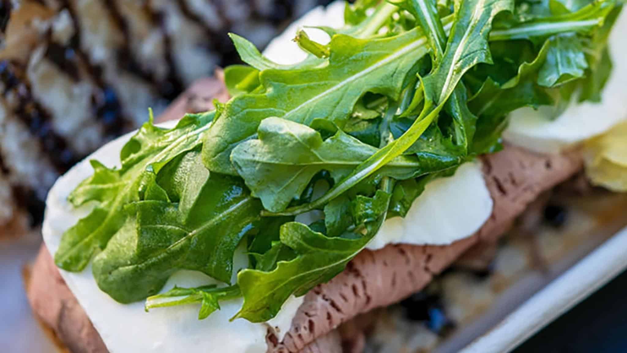 Roast beef sandwich with fresh arugula greens