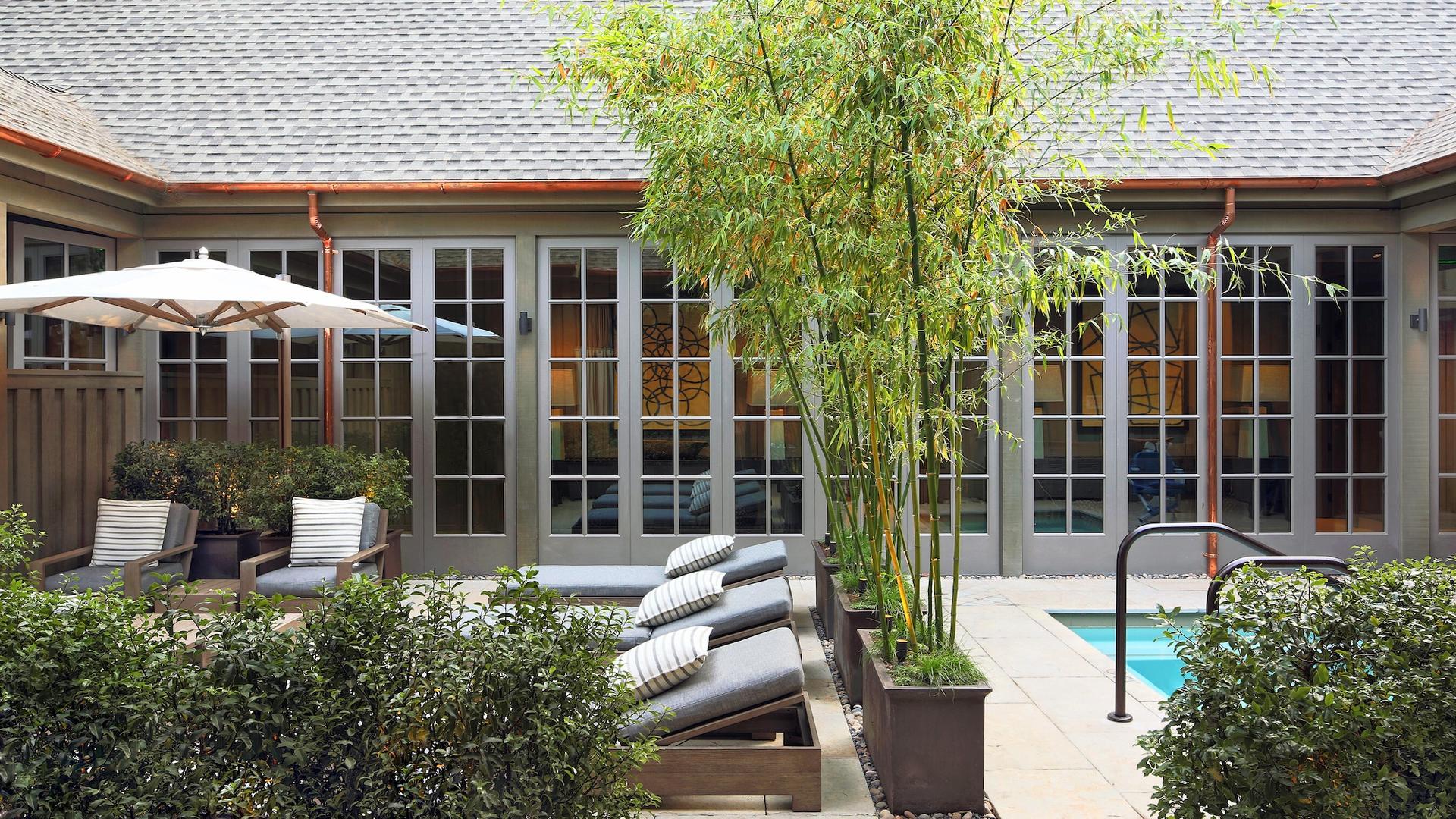 Peaceful courtyard with chairs and bamboo plants