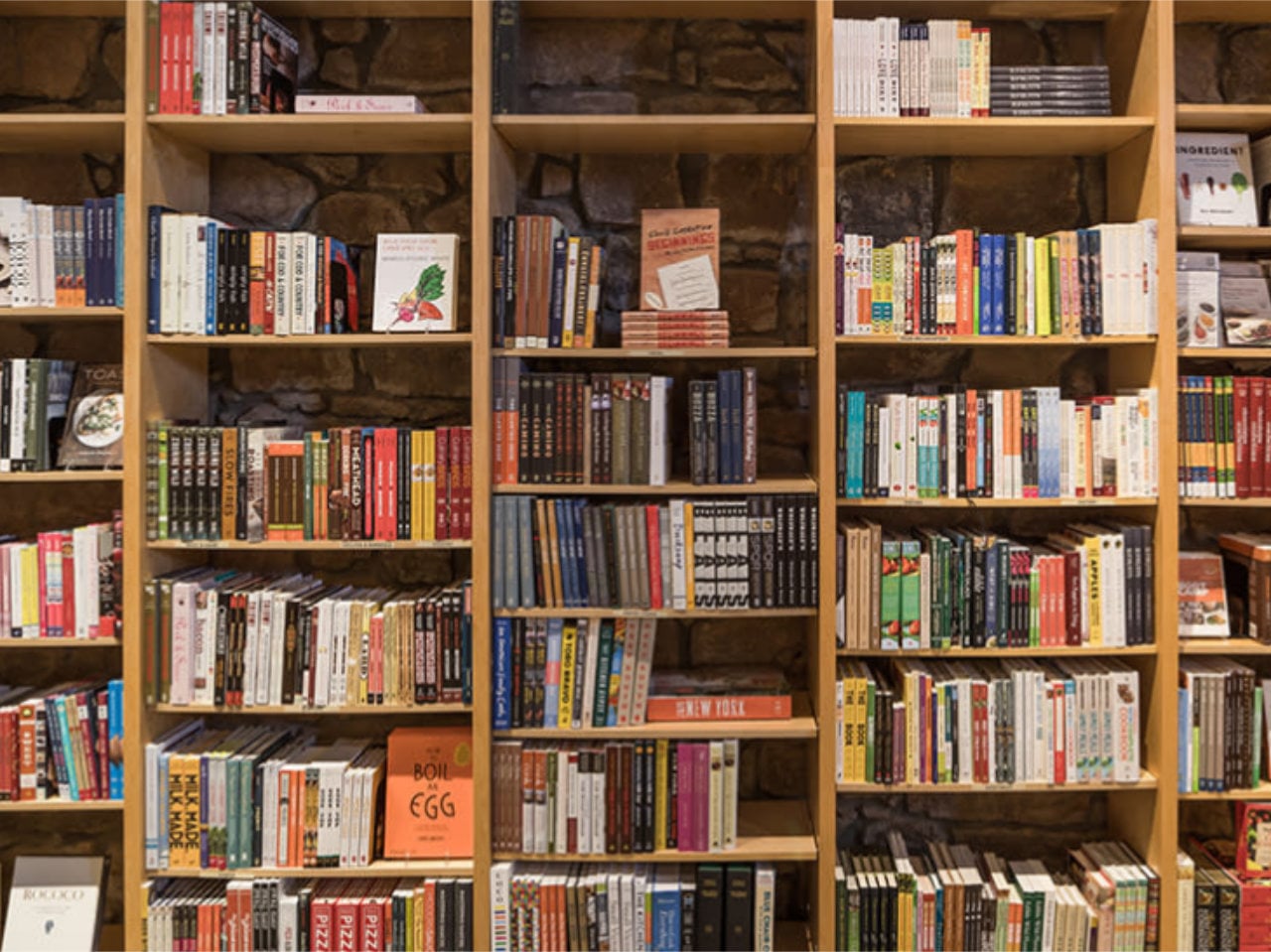 Wooden bookshelves filled with assorted books