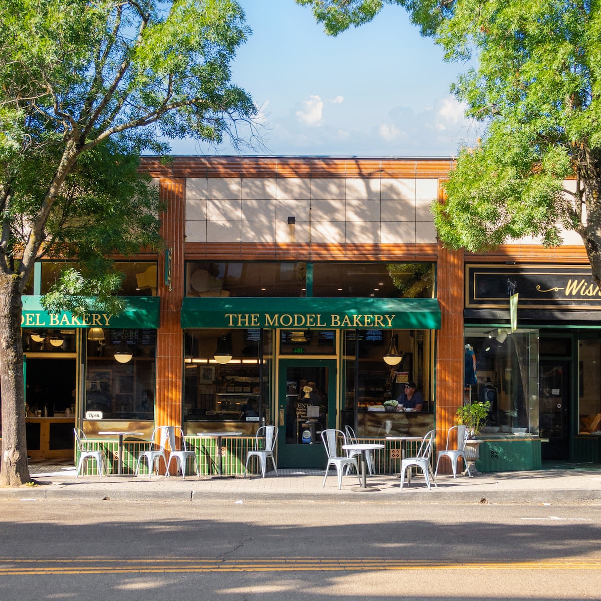 Storefront of The Model Bakery with outdoor seating