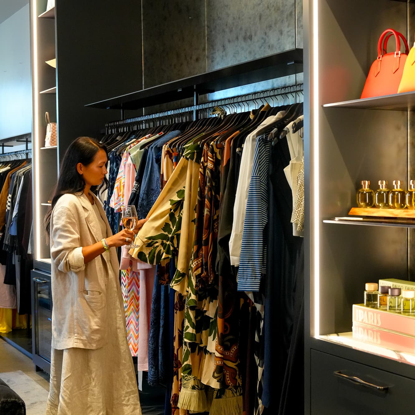 Woman browsing clothing rack in boutique store
