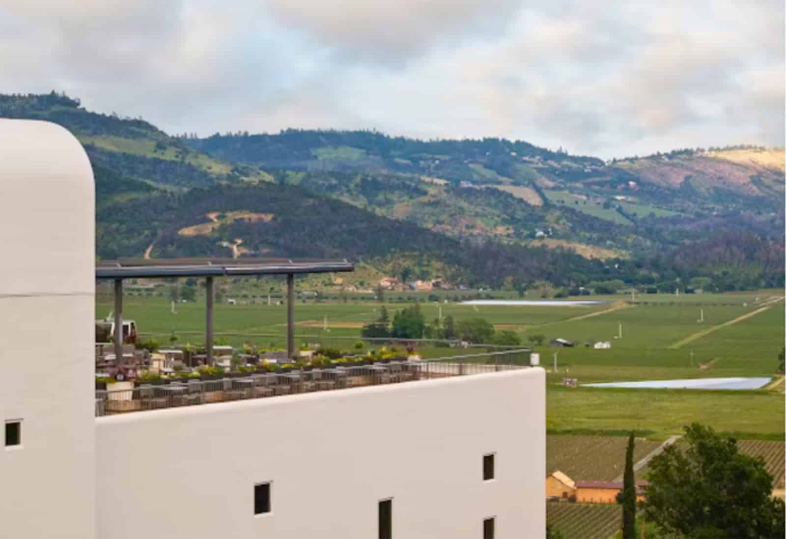 Vineyard landscape with modern building and hills