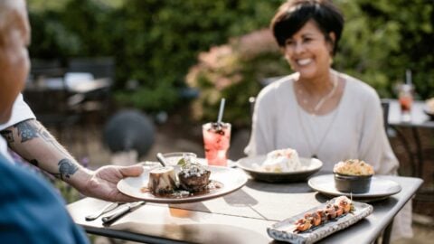 Outdoor dining with gourmet dishes and drinks