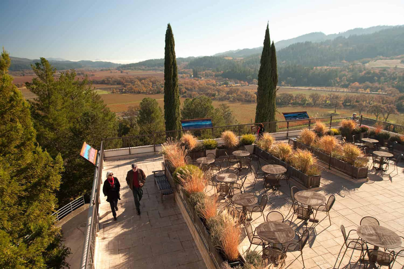 Couple walking on patio with scenic view