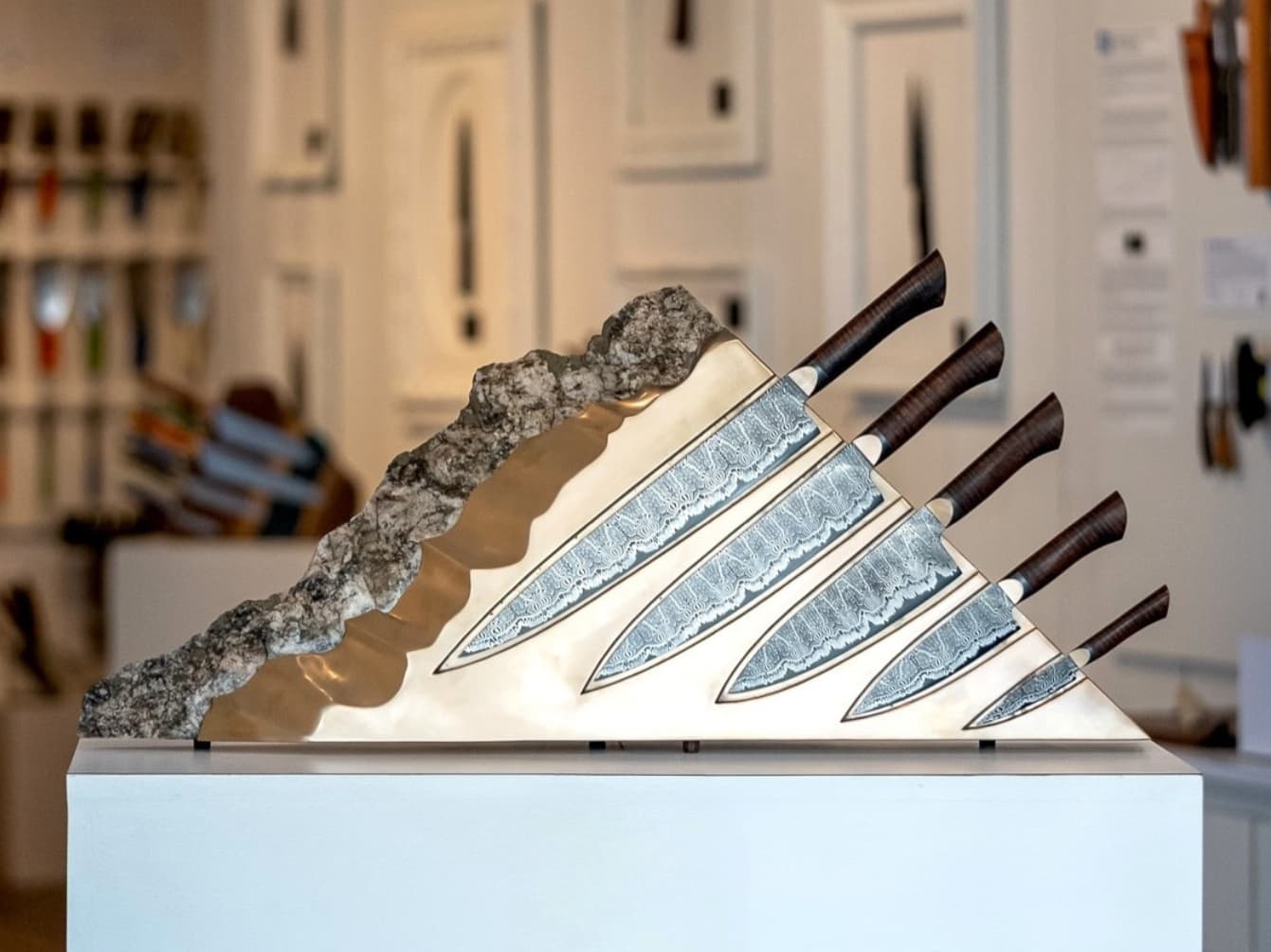 Artistic knife set displayed in stone block