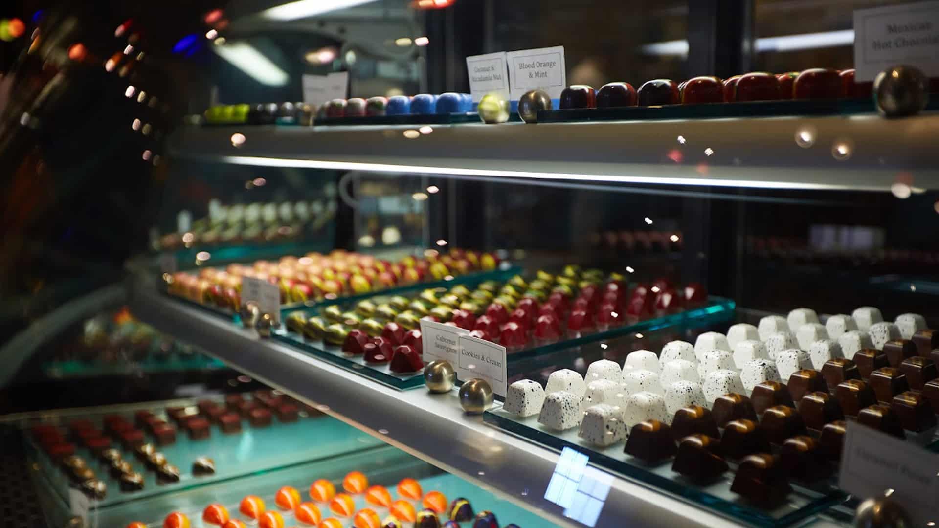 Display case filled with assorted gourmet chocolates.