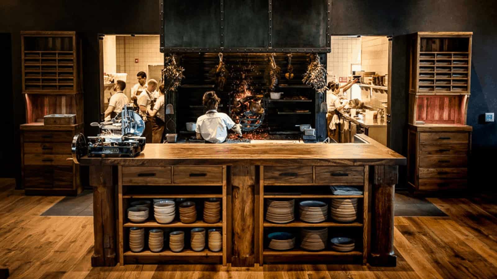 Restaurant kitchen with chefs cooking.
