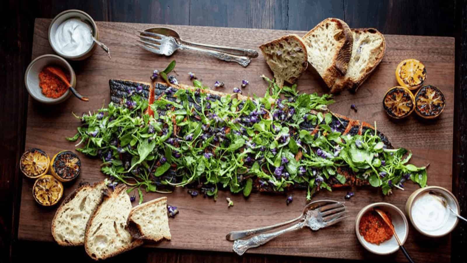 Grilled fish with herbs, bread, and sauces