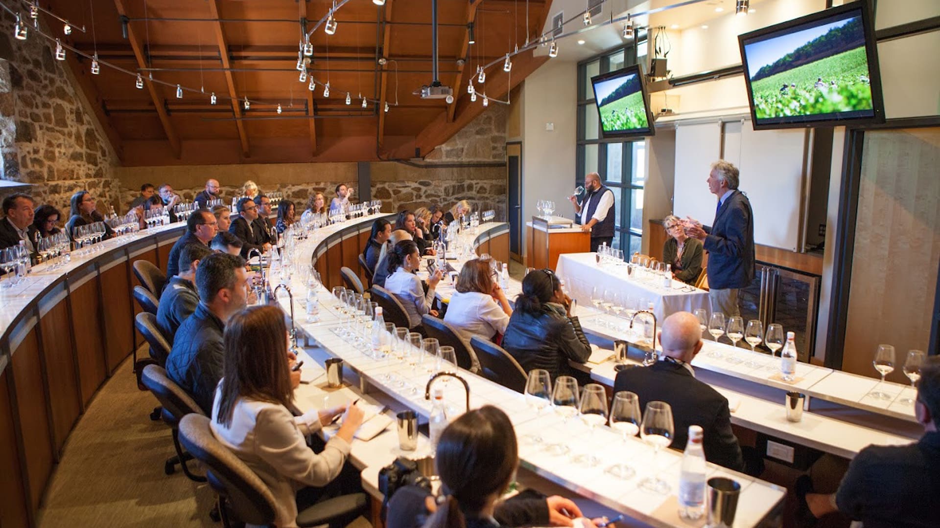 Wine tasting seminar with audience and presenters.